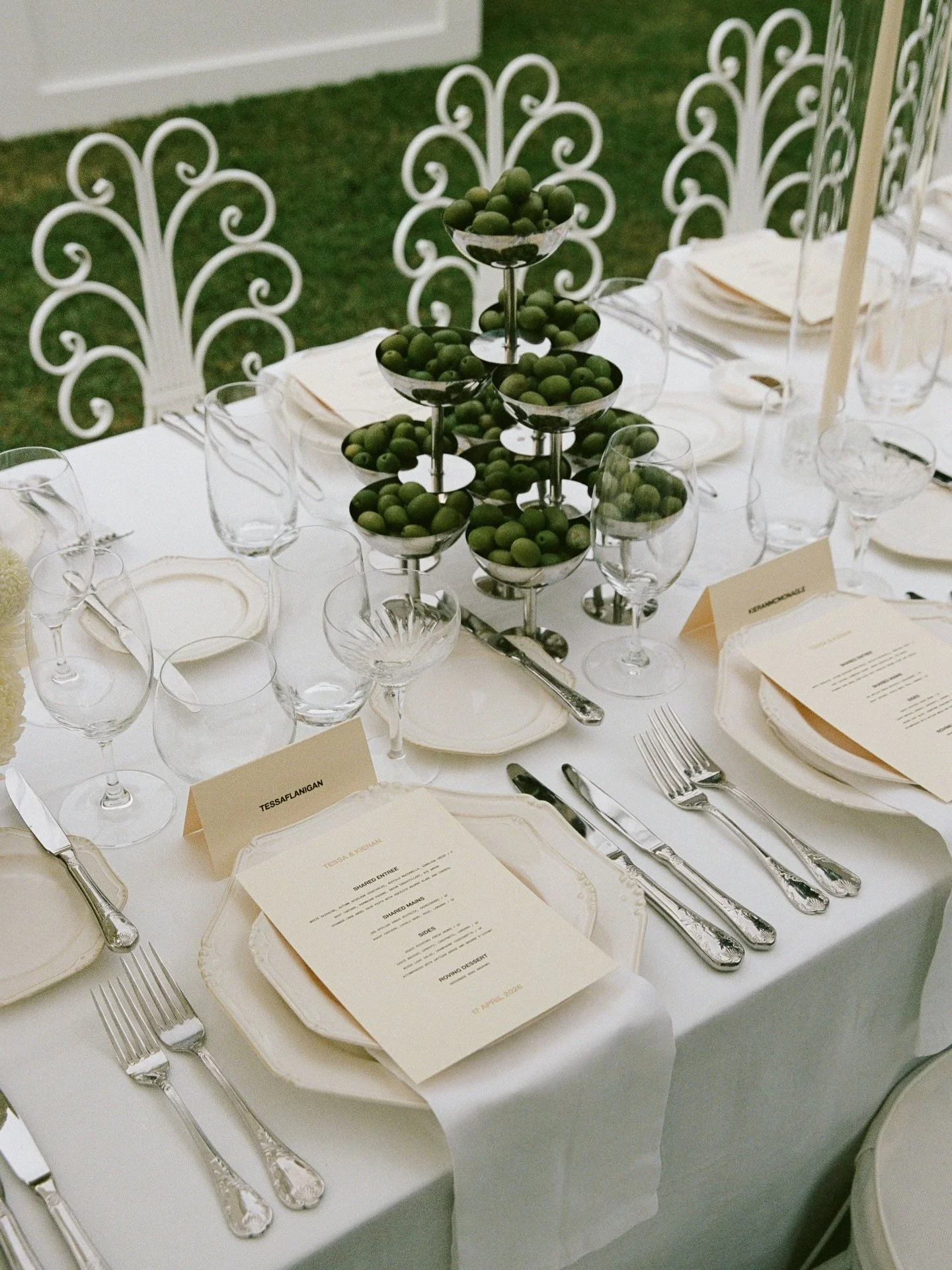 T&amp;K &mdash; Garden Estate Charm 
The reception unfolded with an intimate, understated charm. Nestled within the garden, tables were styled with soft white florals and various green produce on silverware. A timeless, elevated, and romantic celebra