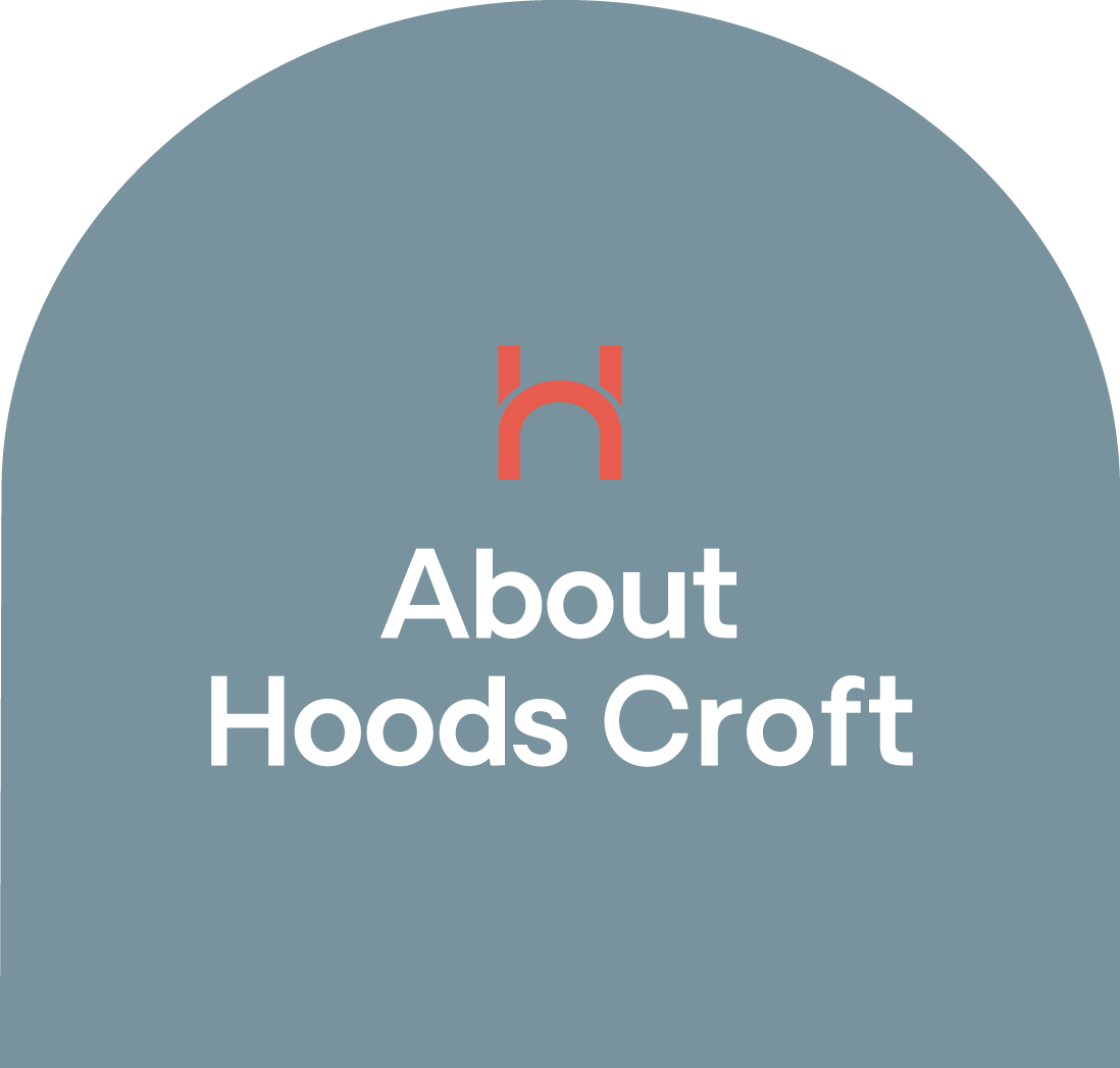 Website header with a grey background, a red logo at the top, and the text 'About Hoods Croft' in white.
