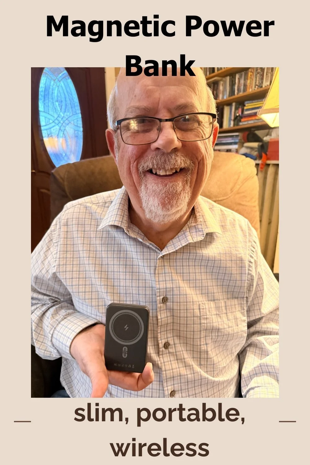 A man smiling while holding a black, slim, portable, wireless magnetic power bank in his right hand. The text above him reads 'Magnetic Power Bank' and below him reads 'slim, portable, wireless'.