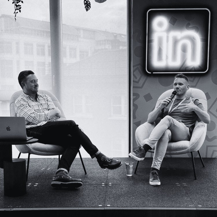 Dean Leak in a fireside conversation on stage