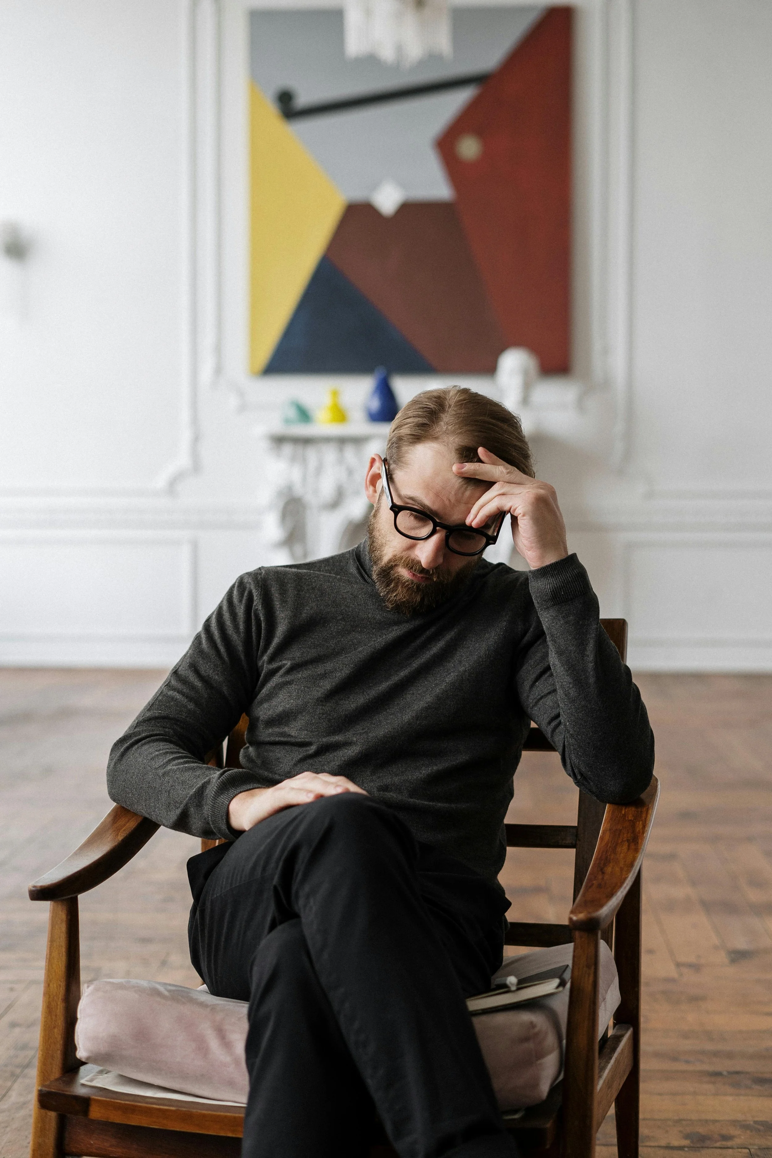 A man looks troubled, struggling with mental health