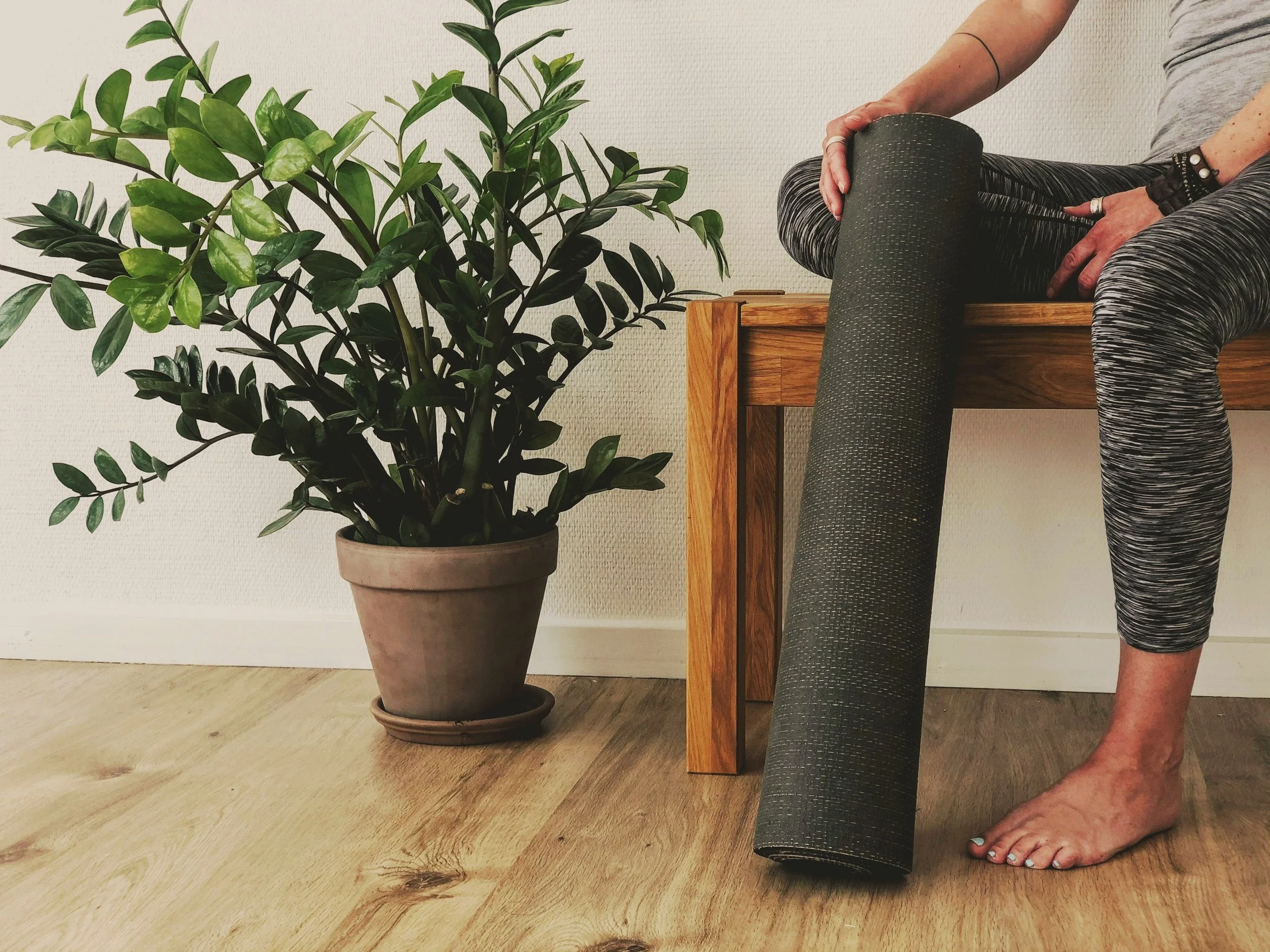 a person holds a yoga mat in lexington kentucky