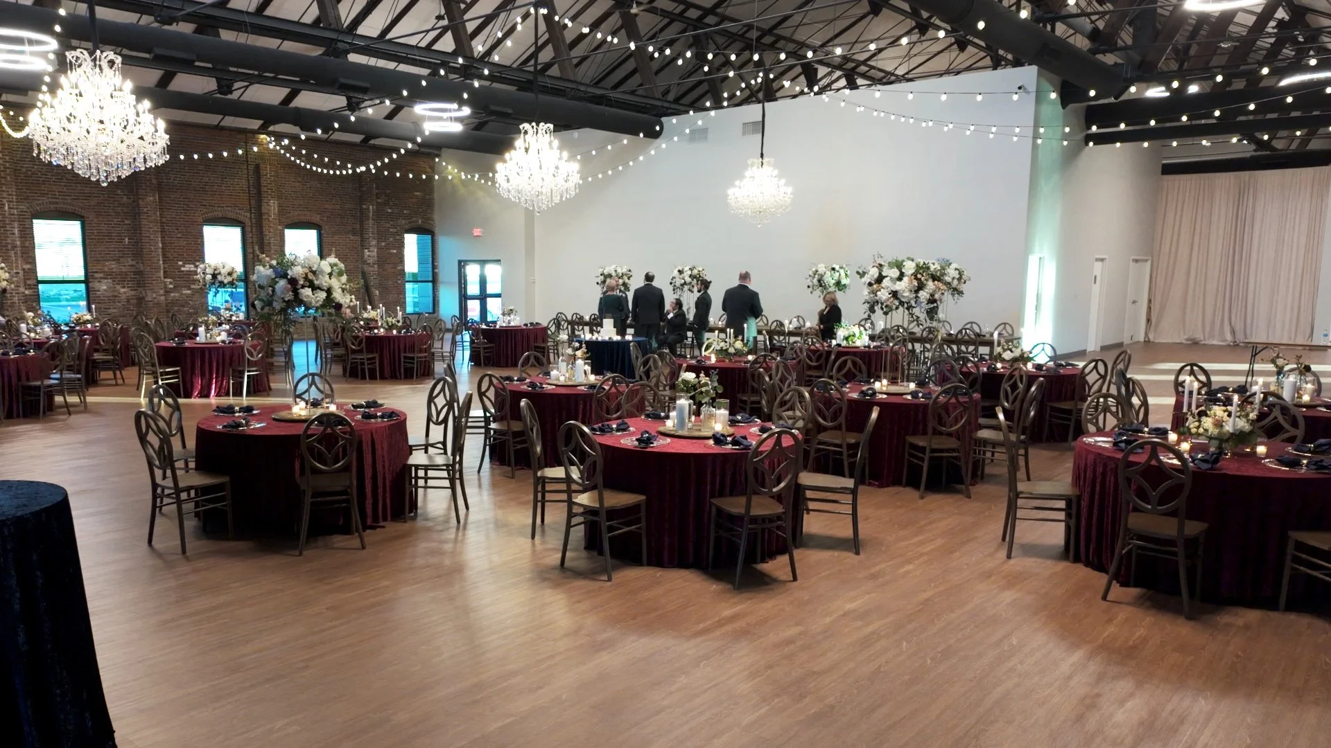 Bobby and Becky's Reception at the Foundry with Maroon table clothes.