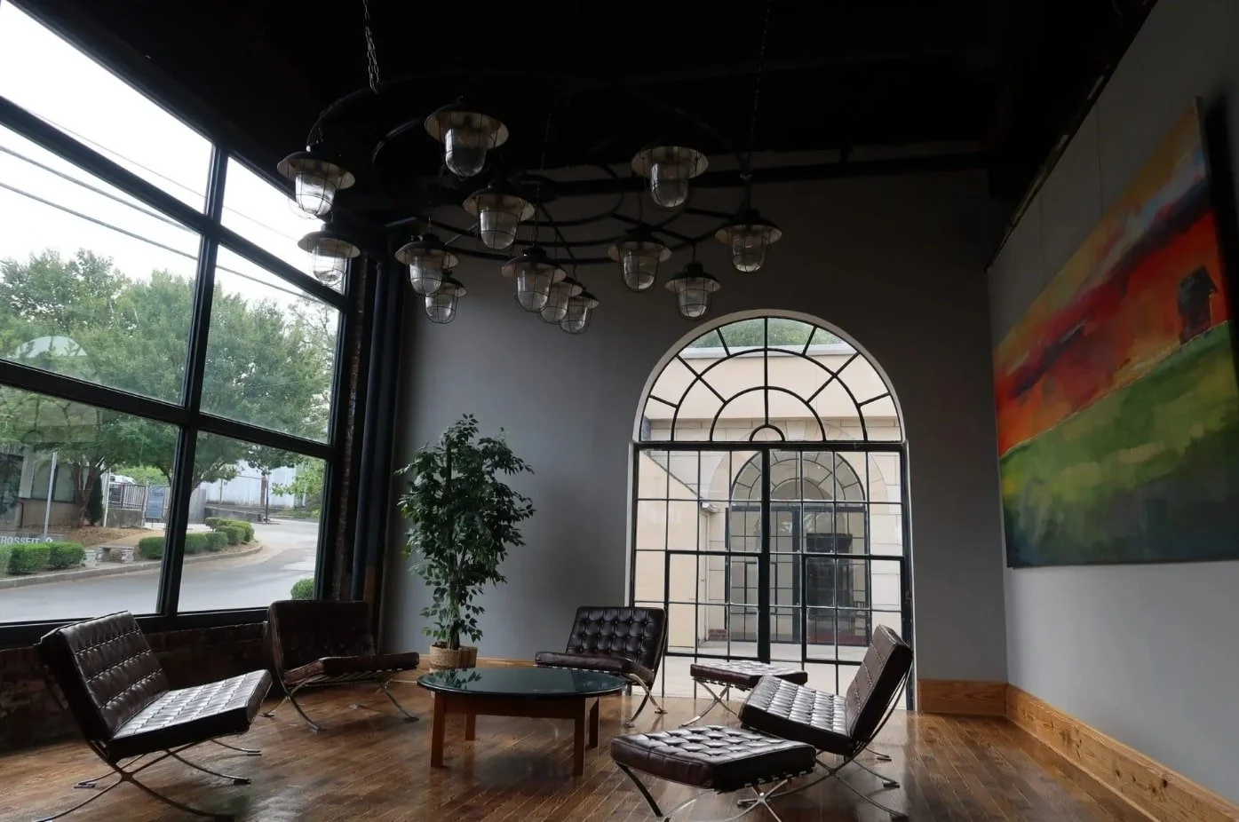 The Da Vinci Room wedding venue in Louisville featuring exposed brick, modern industrial lighting, and spacious guest seating