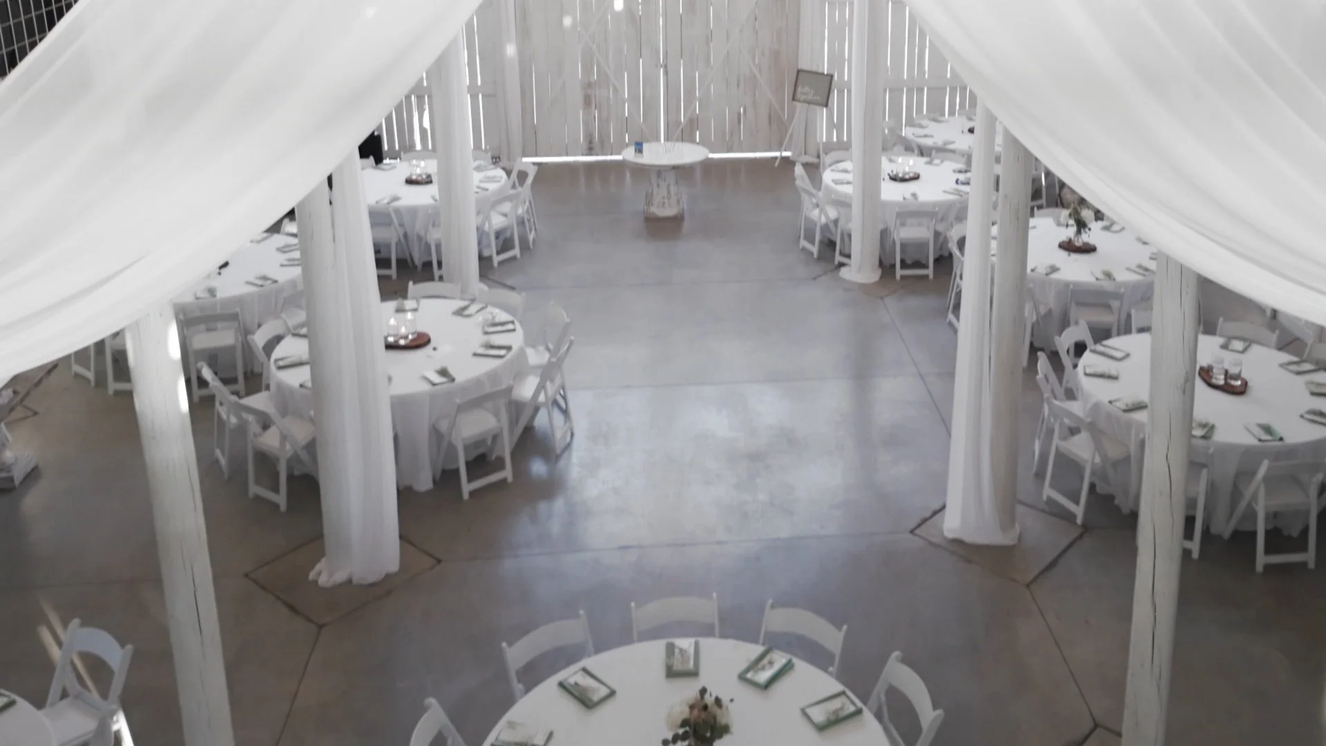 Inside the white barn ready for the reception