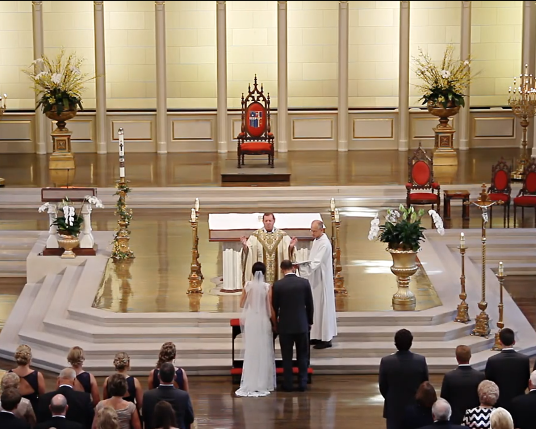 View from the balcony of a ceremony with bride and groom