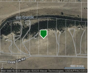 A map showing a winding road labeled Rio Grande, with a green marker at a specific location near Deep Creek Road, surrounded by a grassy area.