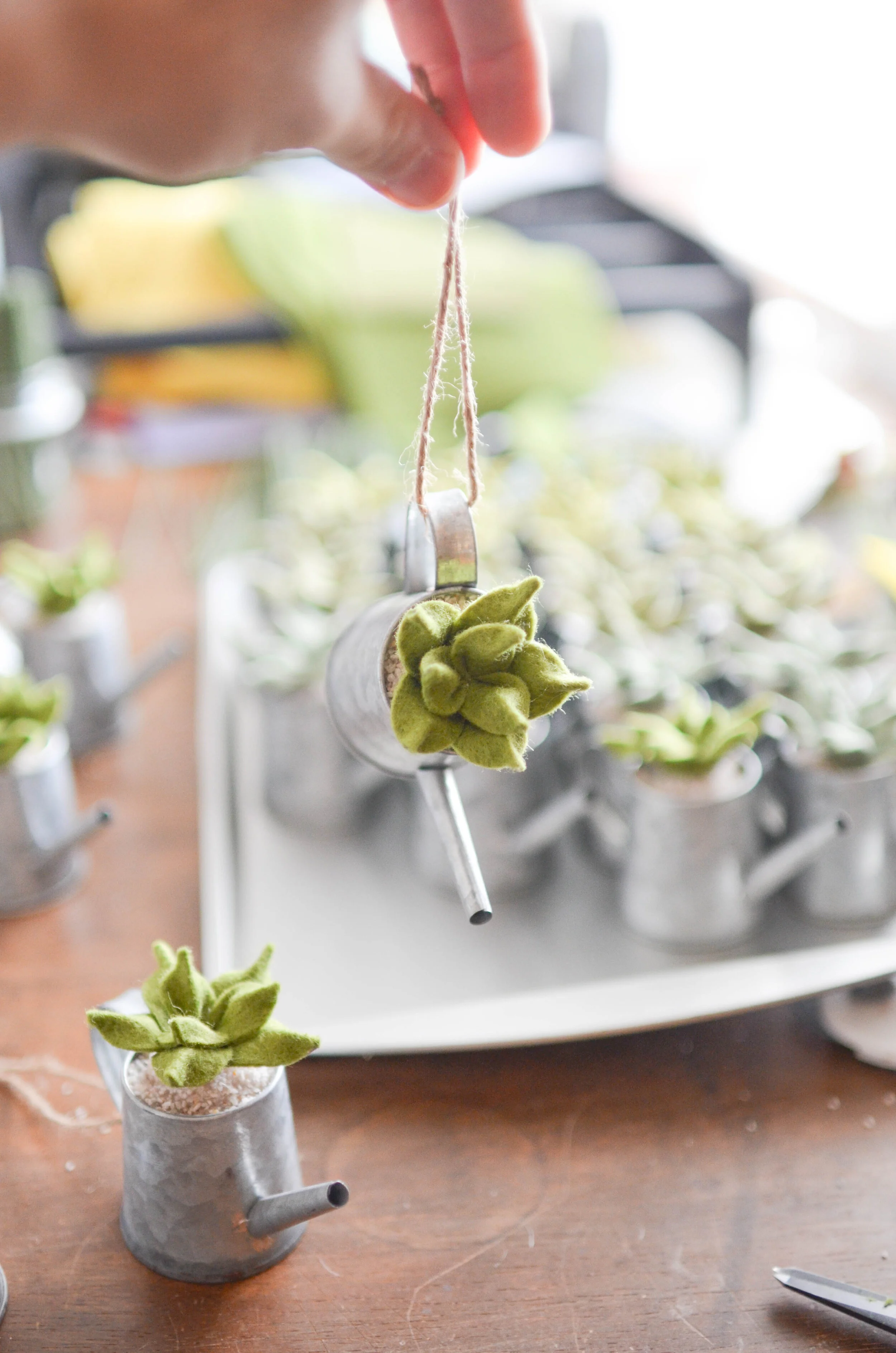Click through to see a selection of past ornaments made for St. Christopher Gardens and MISC Studios. Felt fruit and mini watering can succulents are fan favorites. The mini wreaths can be any color combo we like- and we can even add a custom laser e