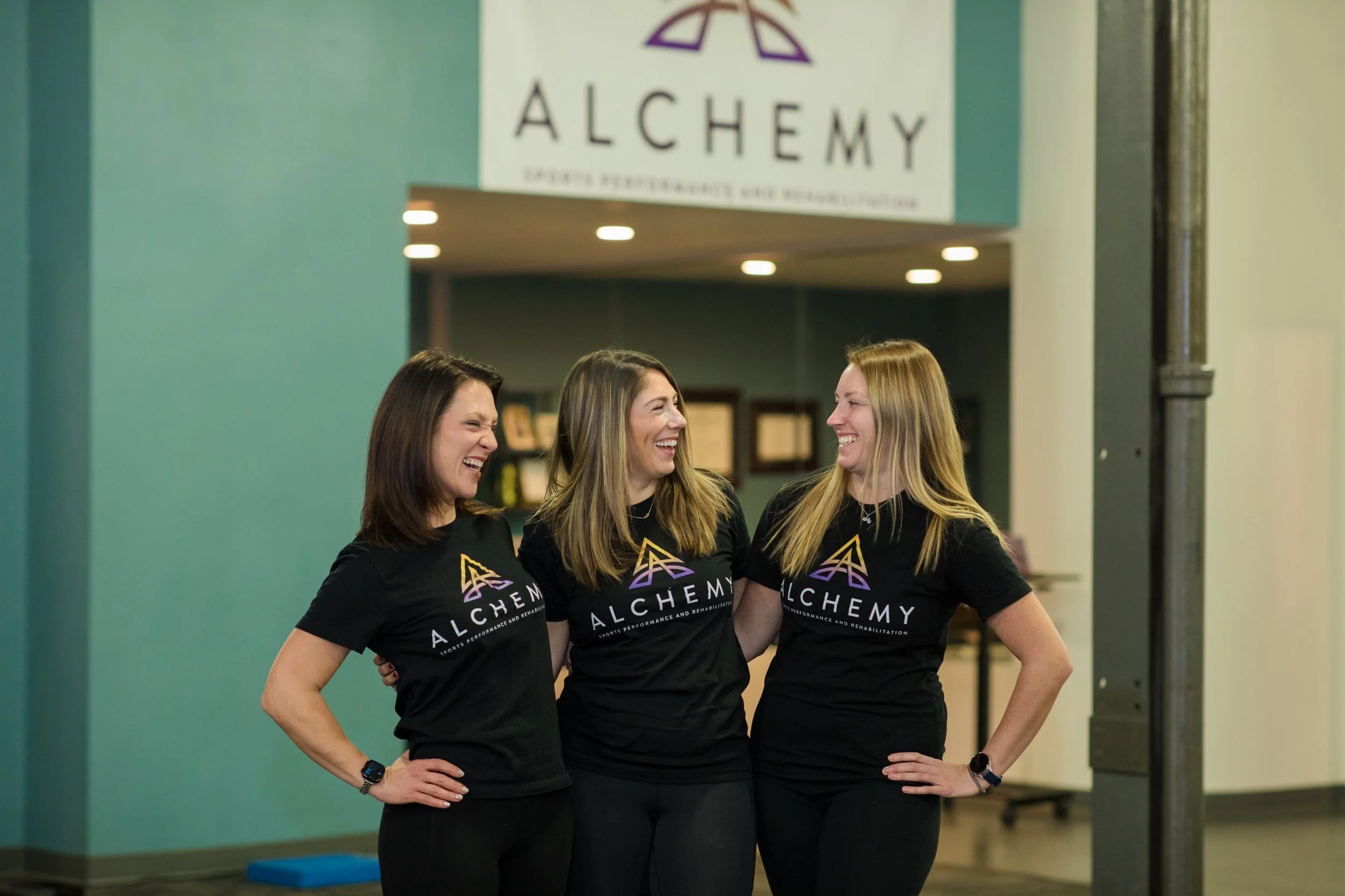 Alchemy Sports team posing for a picture