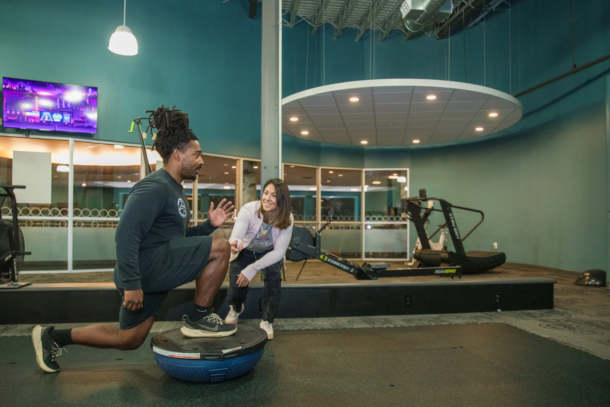 Deanna working with someone on balance