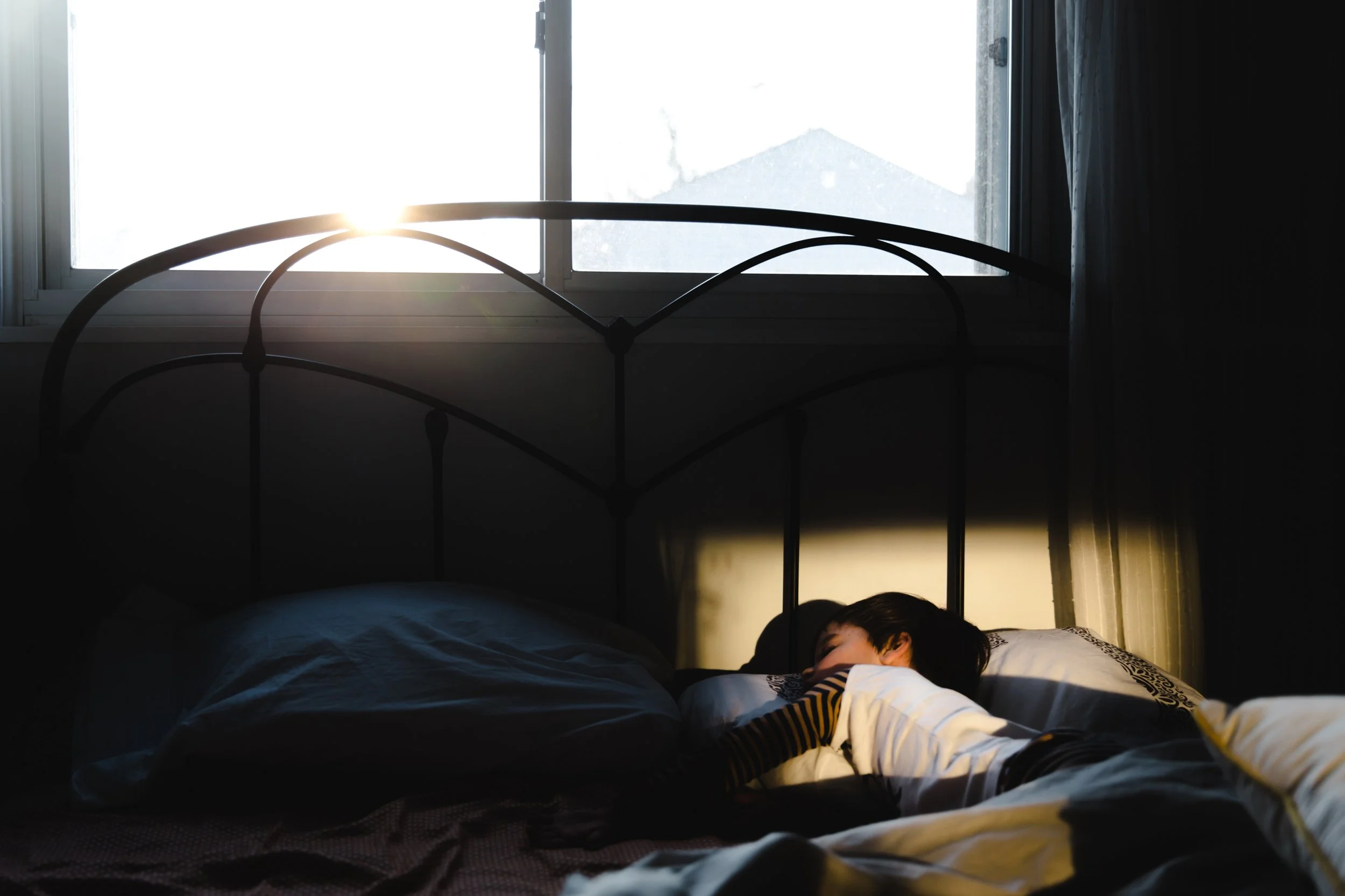 Child sleeping peacefully - pediatric sleep health care at Rebis Health Colorado.
