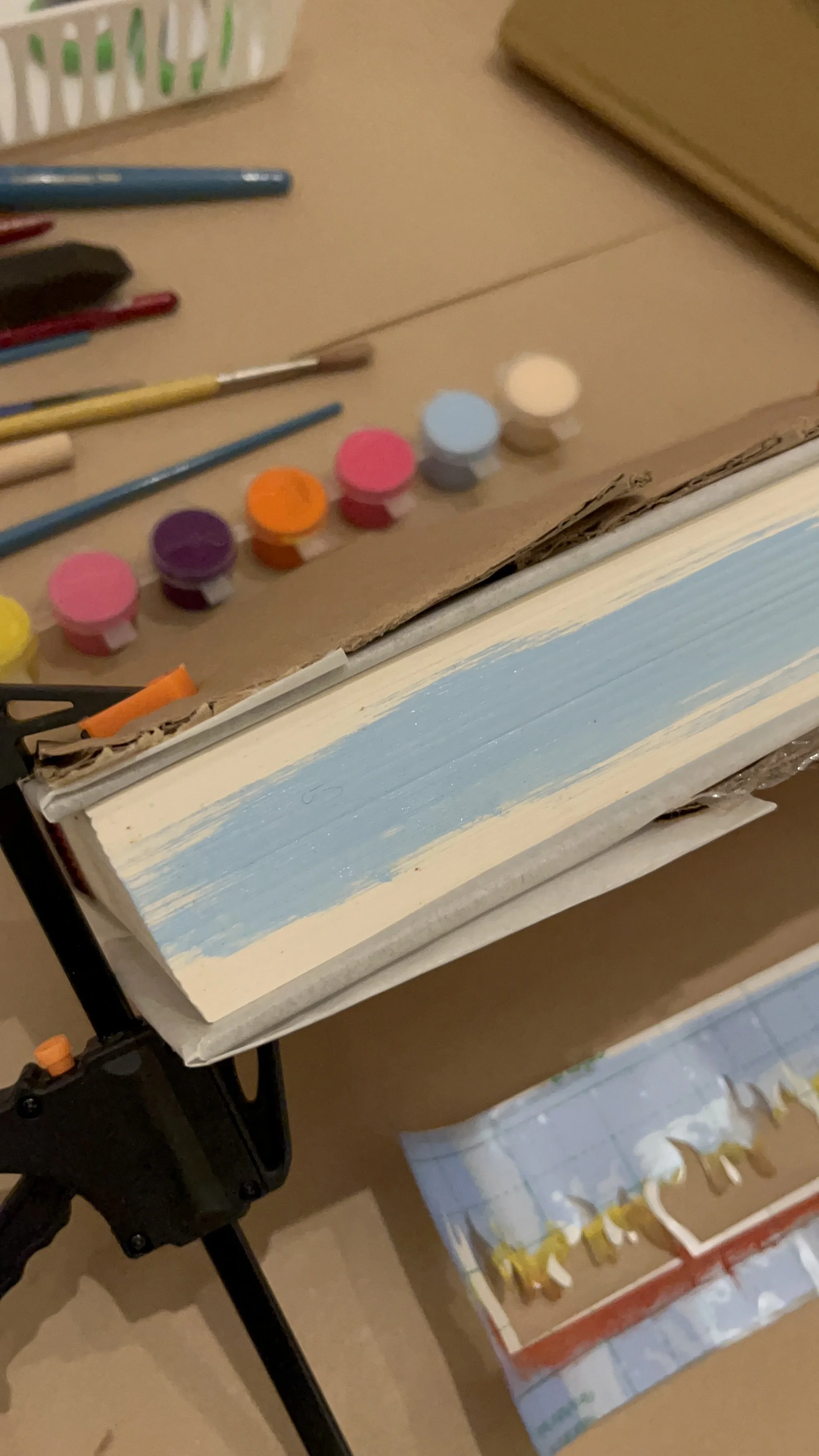 painting blue pages on book edge