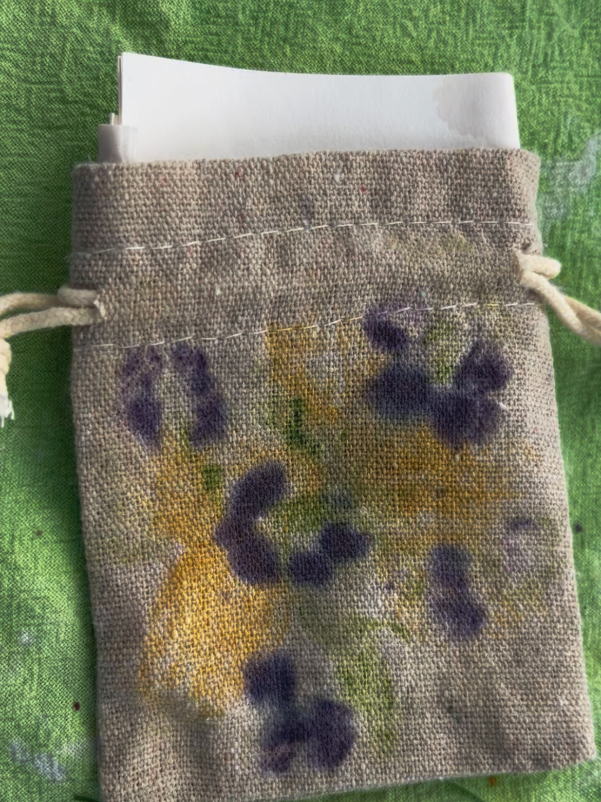 botanical print bag sitting on green table cloth