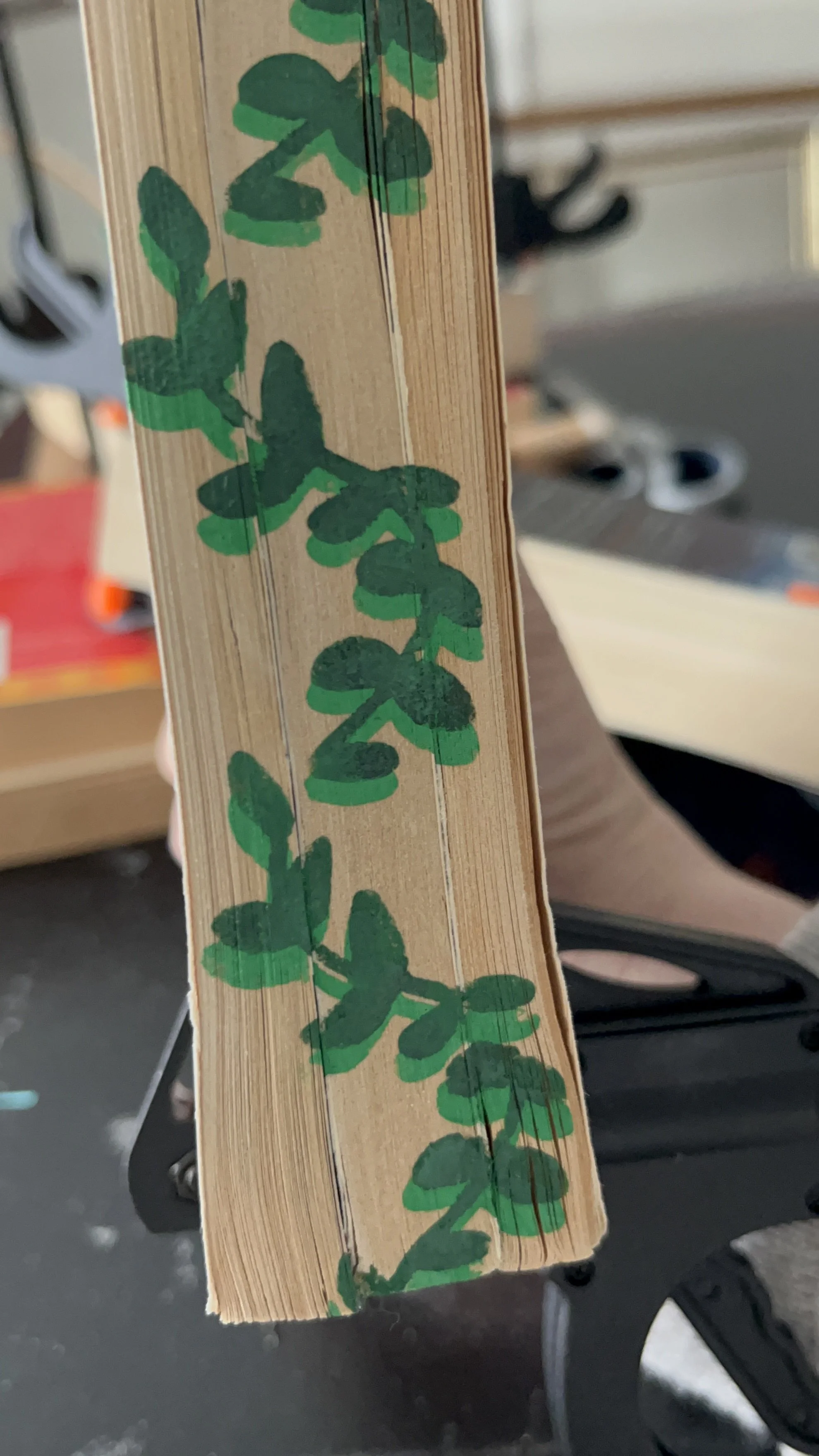 leaves stenciled on book edges