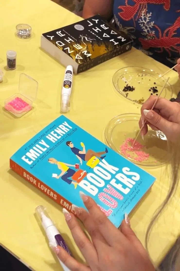 bedazzling book book lovers with pink gems on yellow table cloth