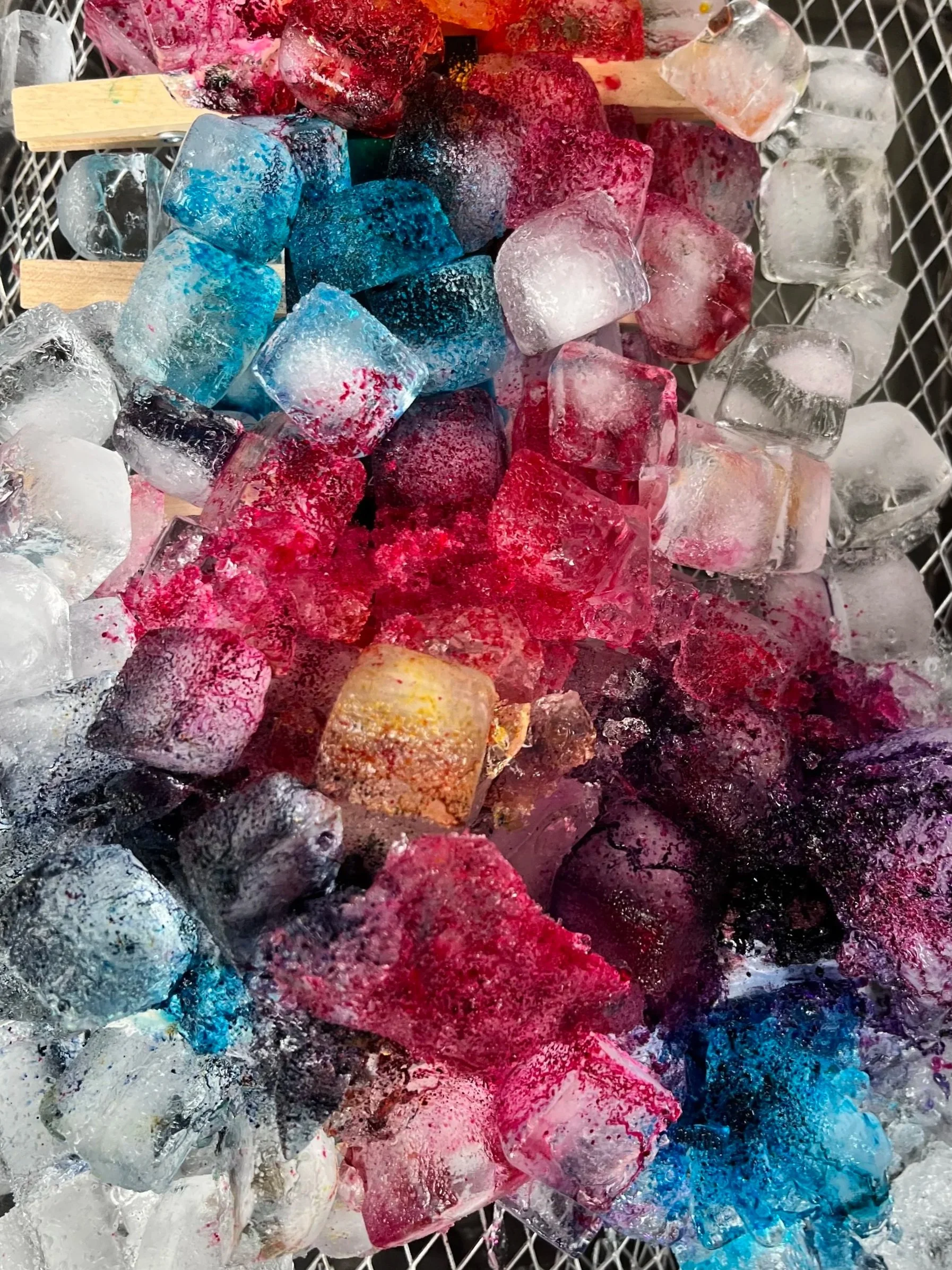 ice dye with blue and pink and yellow on a metal grate for DIY crafts in greater Boston with Slow Craft LLC