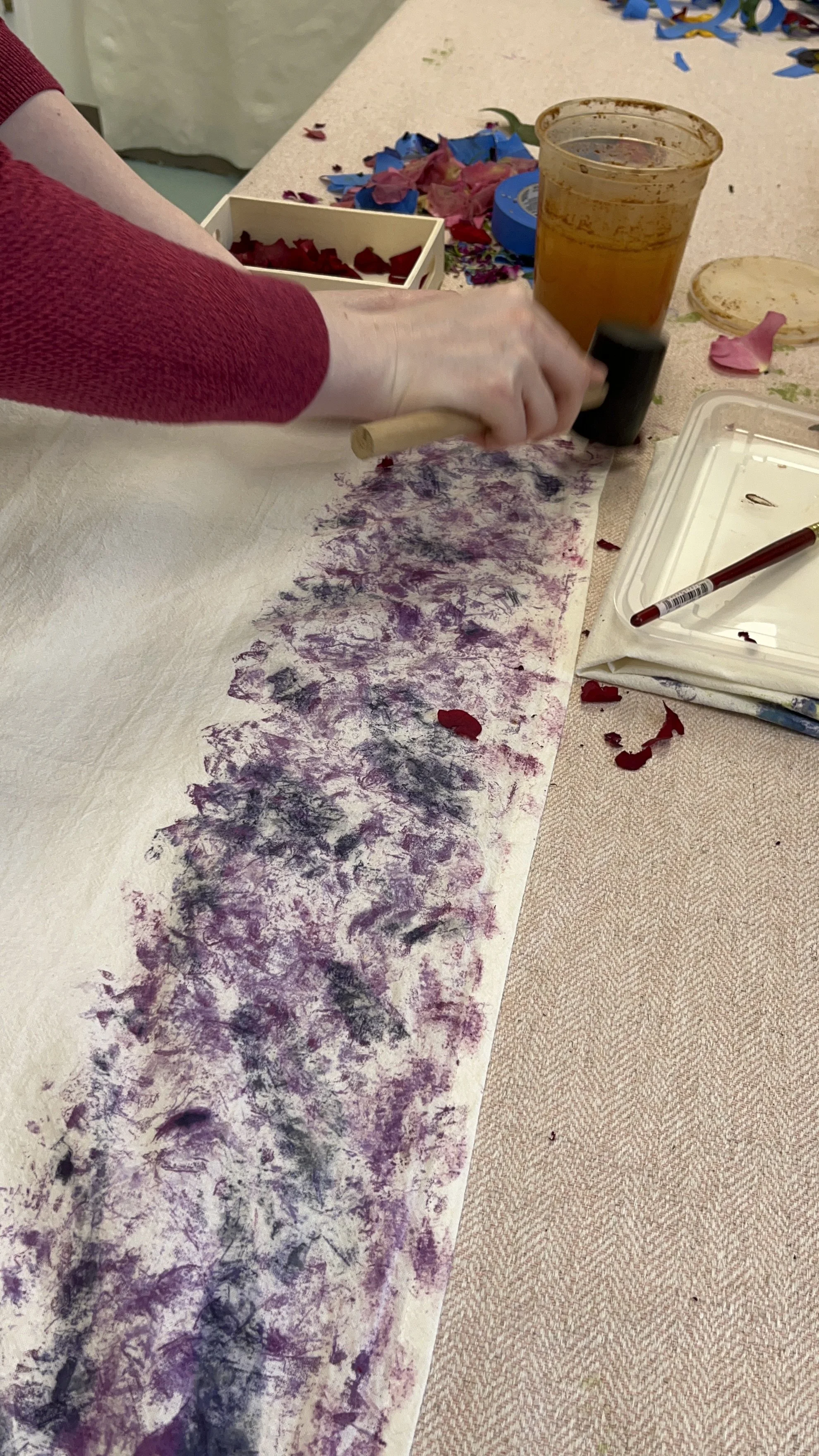 participant making botanical printed tea towel