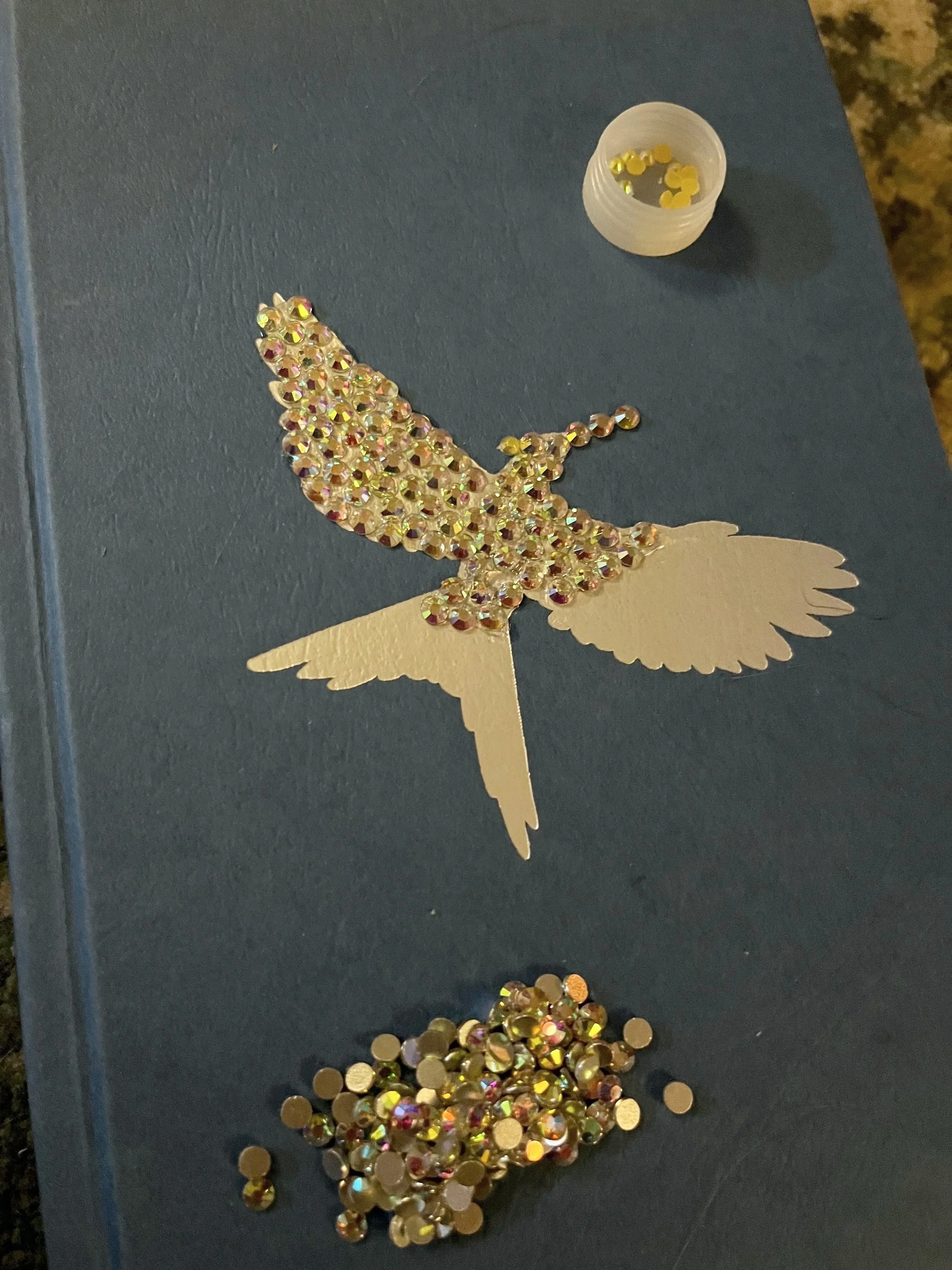 gemstones on top of motif on a book cover