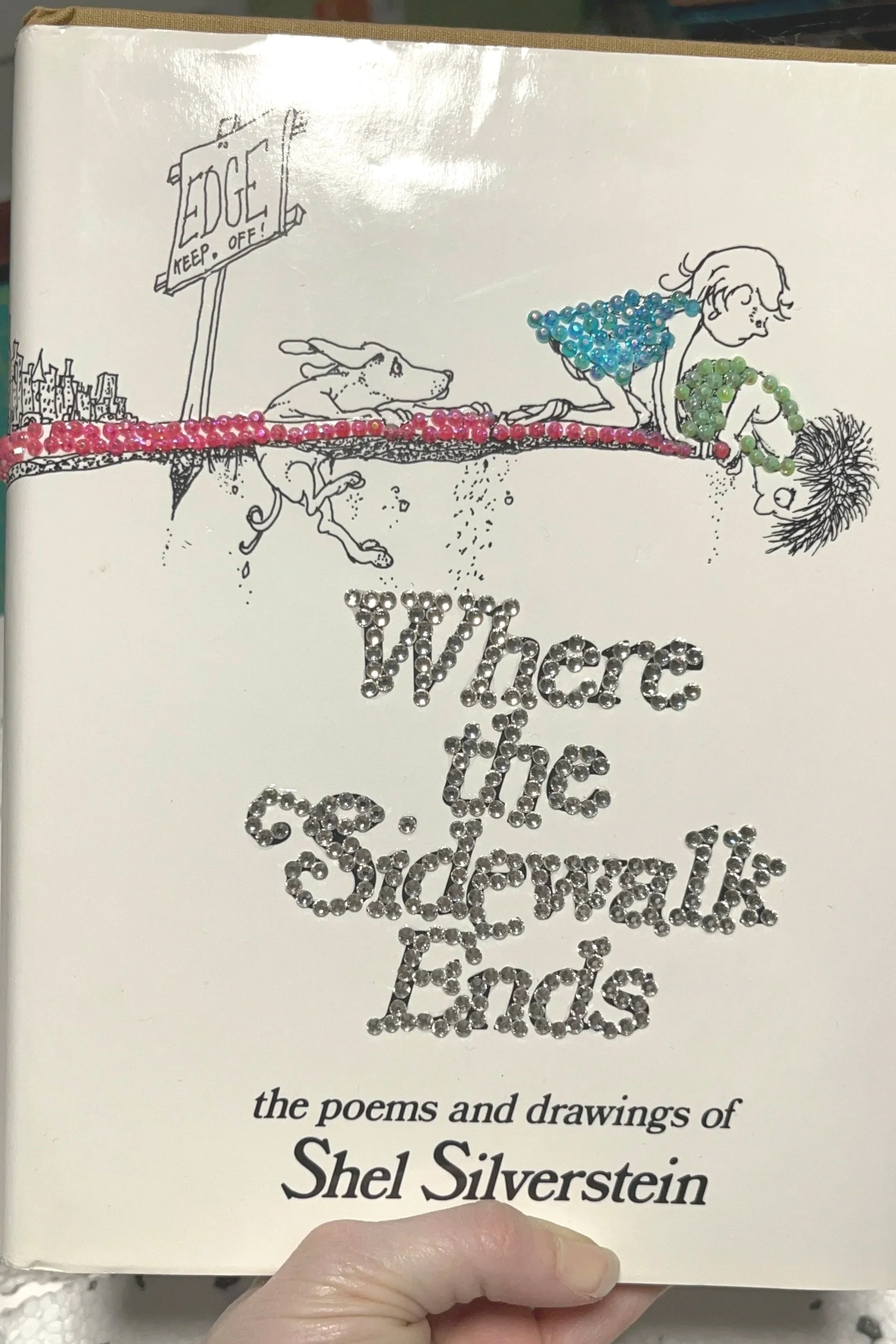 bedazzled book with bright gemstones