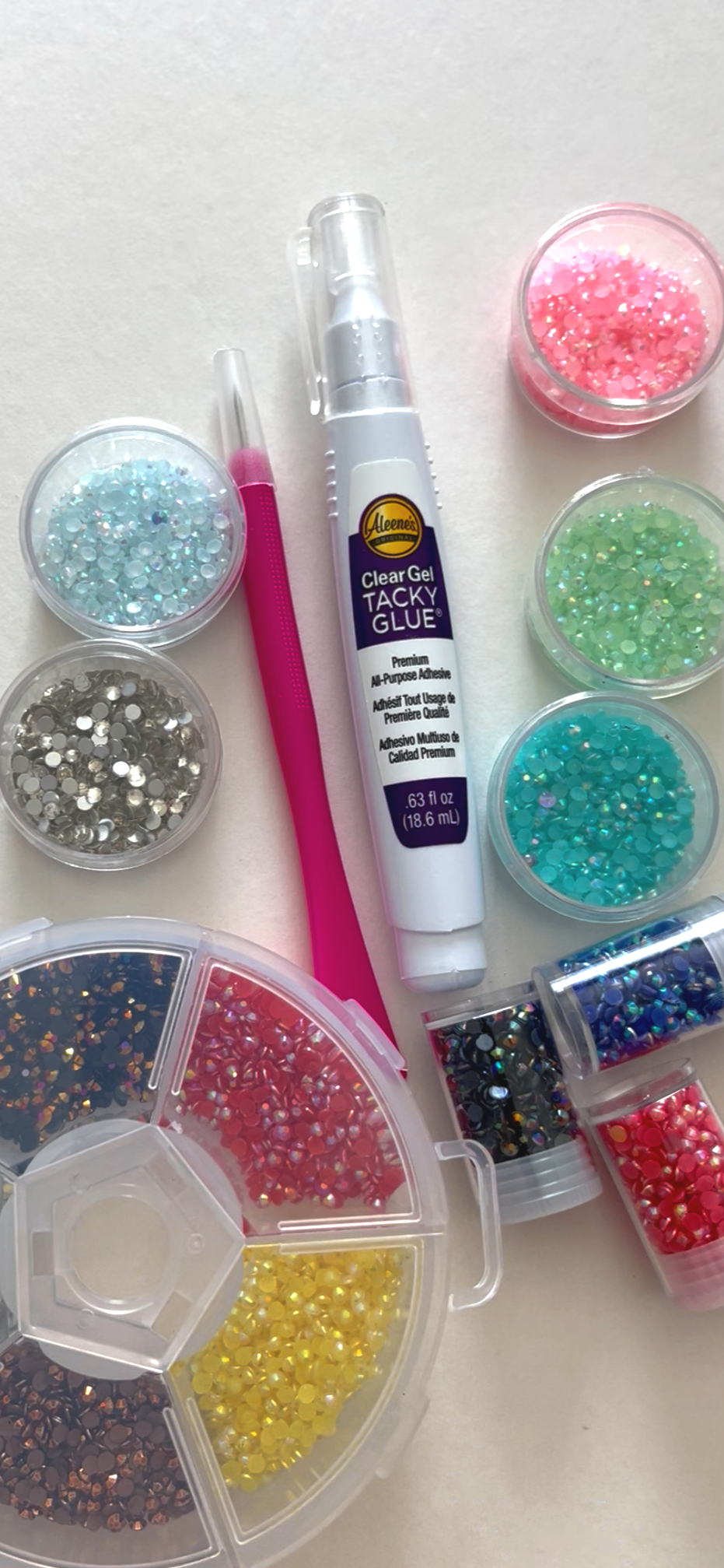 tools for applying gems and rhinestones, stylus, glue, many gems