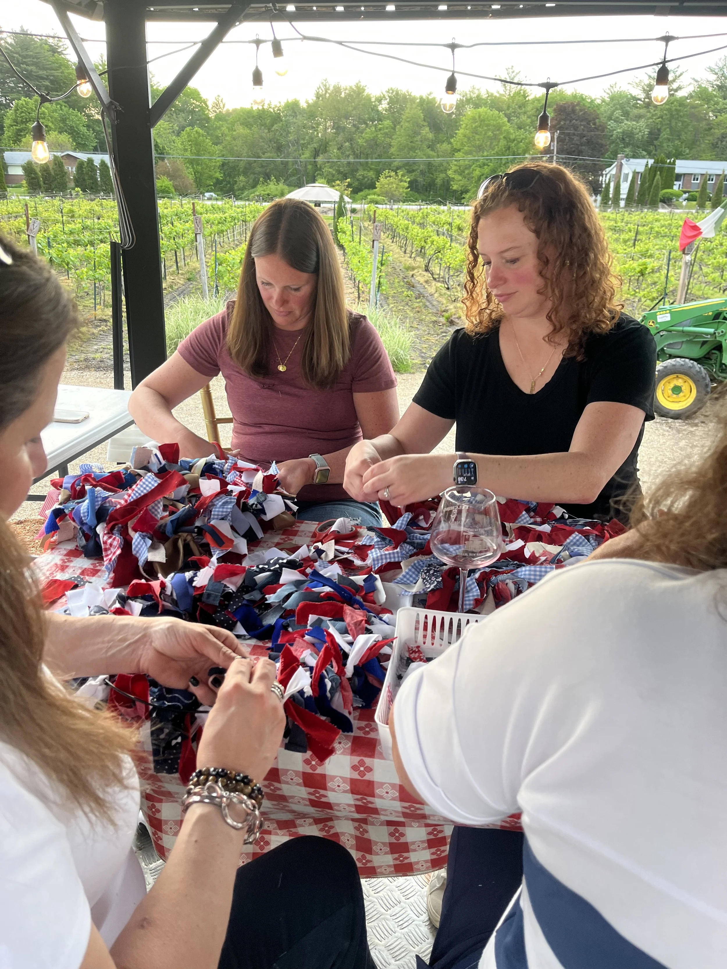 crafters making wreaths in outdoor venue