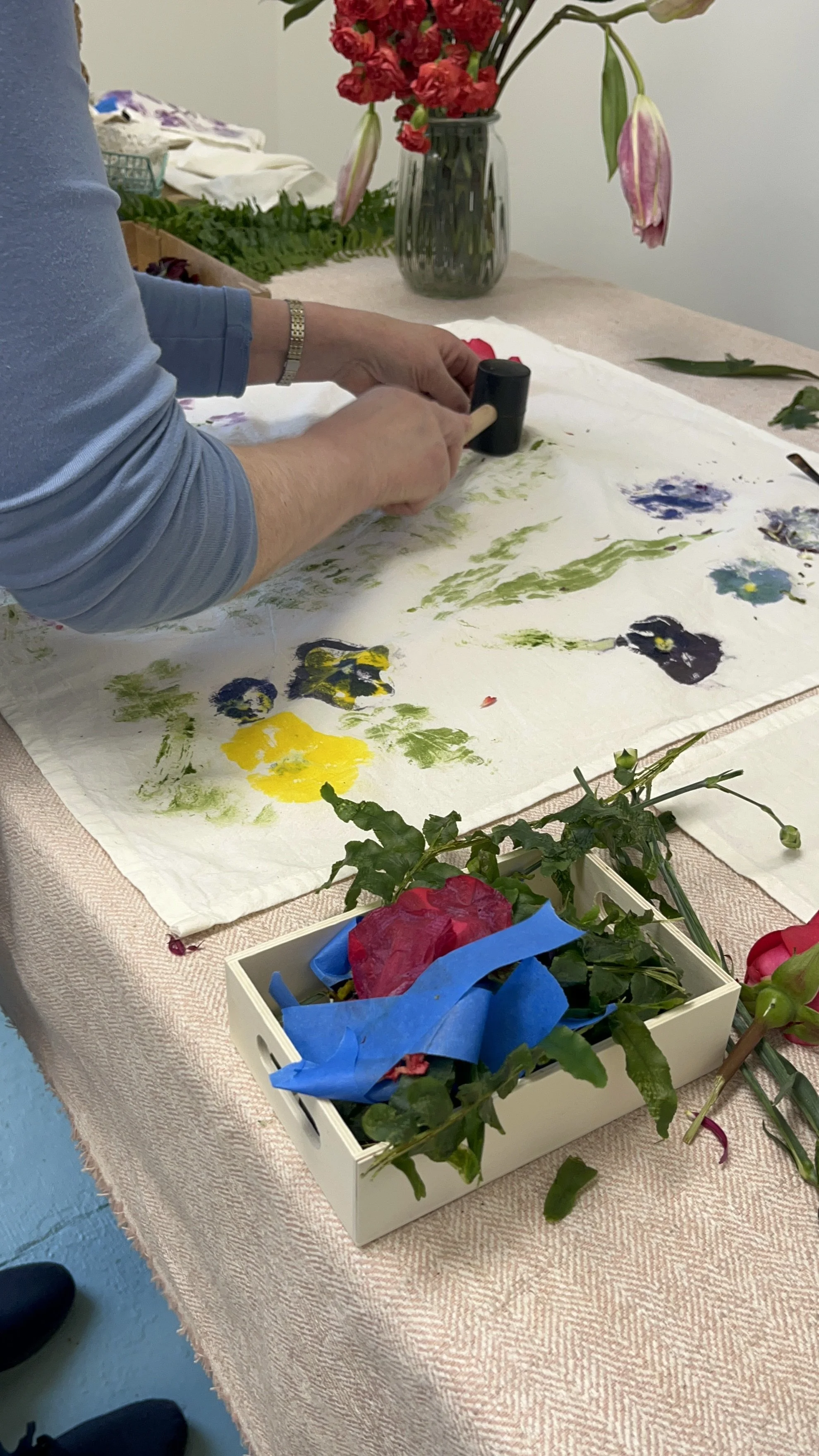 customer working on botanical printed tea towel