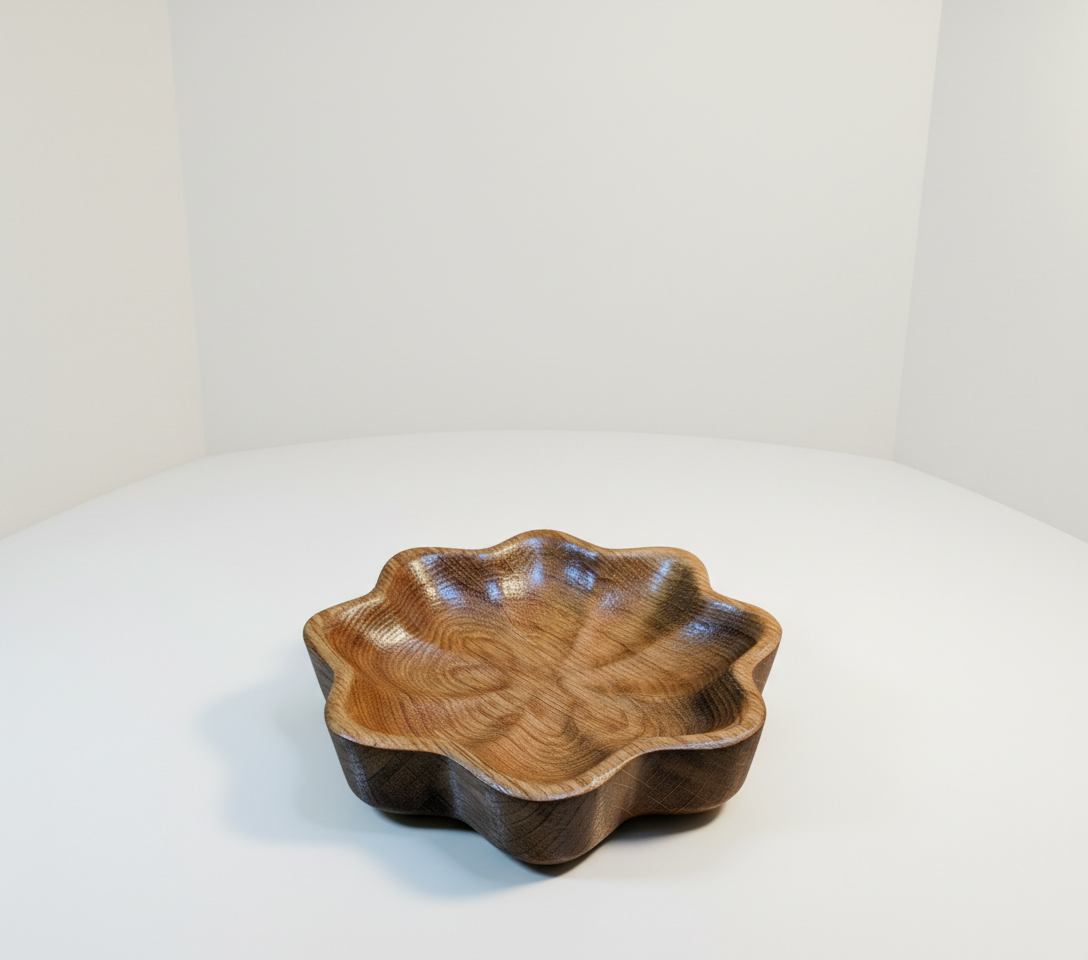 A wooden decorative bowl with a scalloped edge on a white surface against a plain white background.