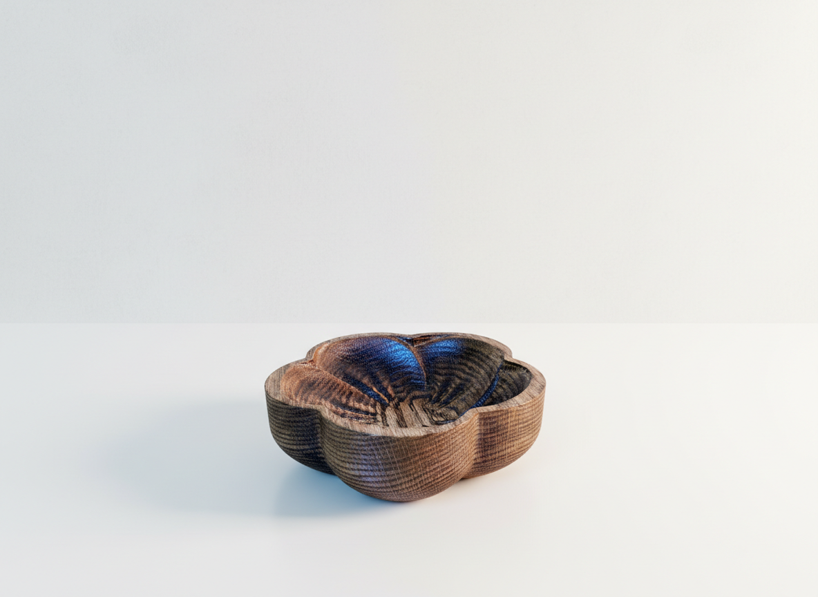 Wooden bowl shaped like a flower, with a dark and light wood grain pattern, set on a plain white surface with a light gradient background.