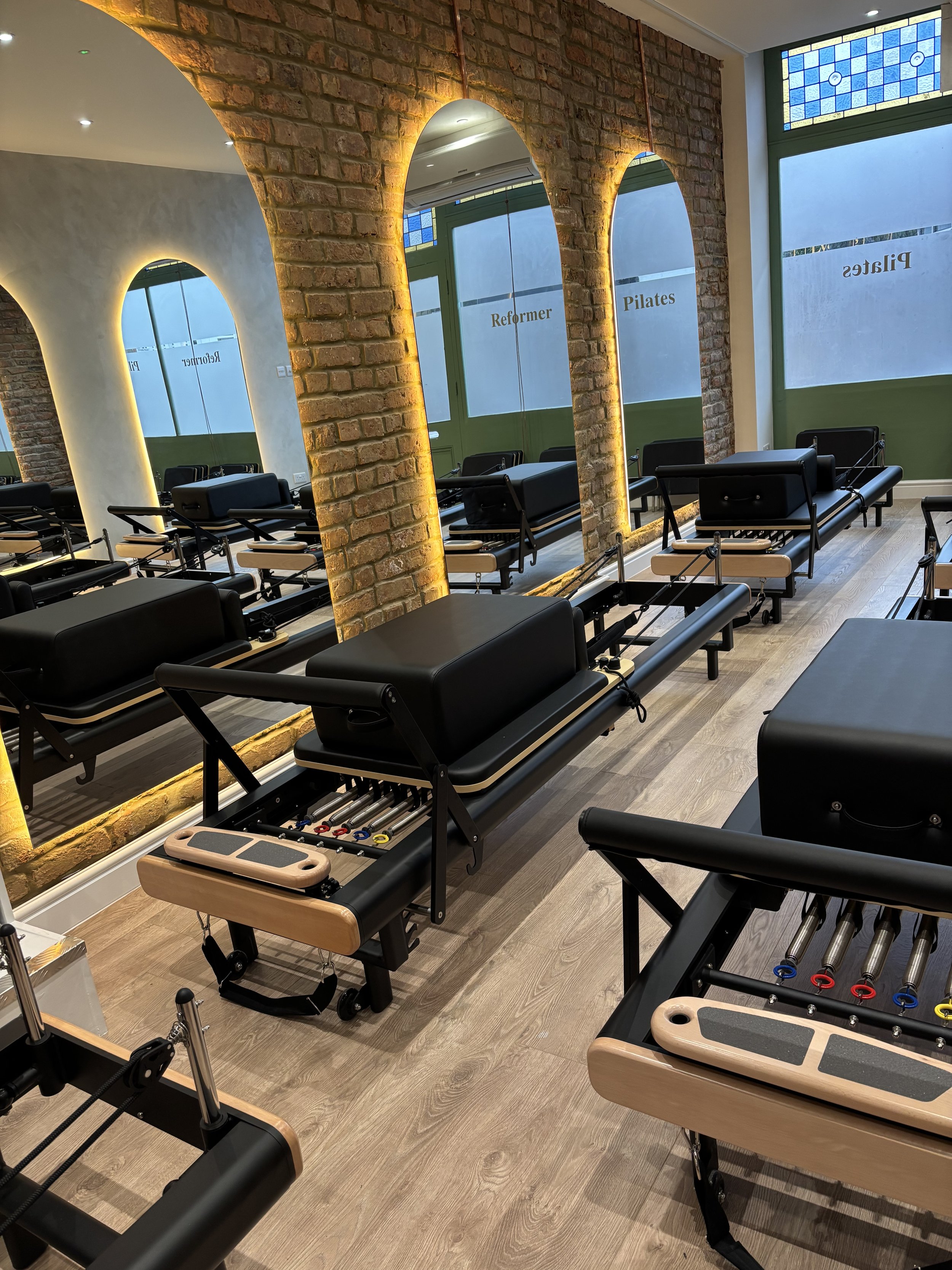Reformer Pilates studio with reformer beds and studio equipment