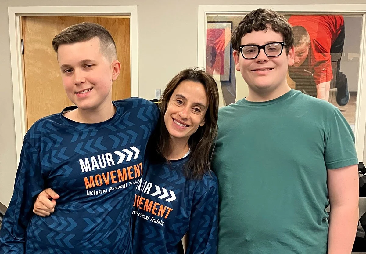 Kristen with two male students smiling