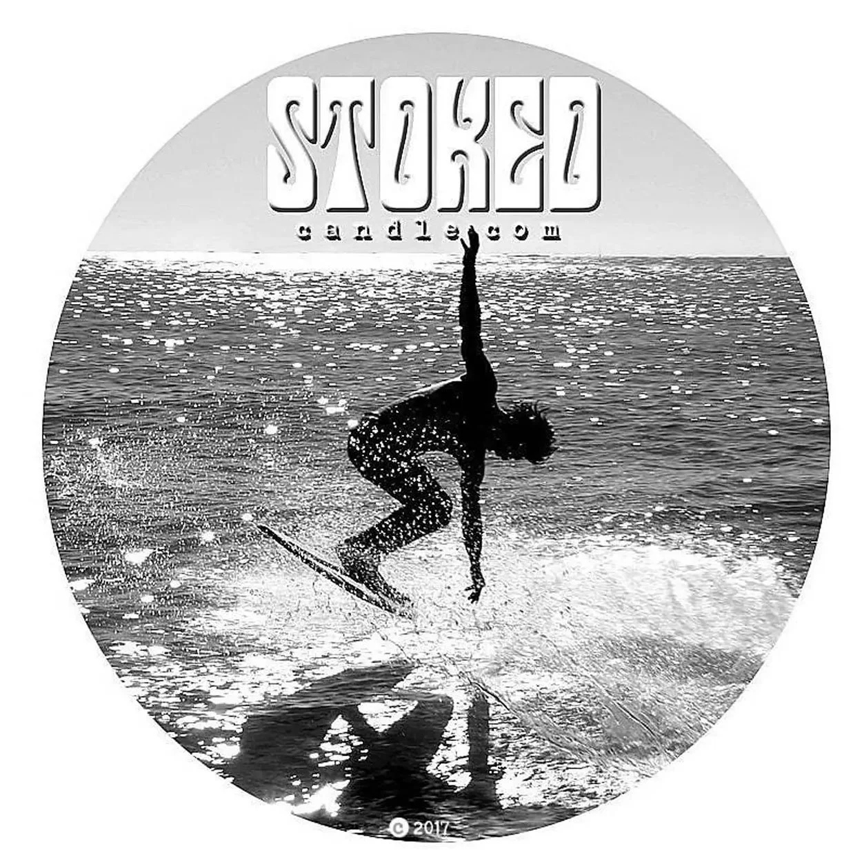 Stoked Candle circular logo with black and white surfer photo and "Stoked candle.com" text on white background