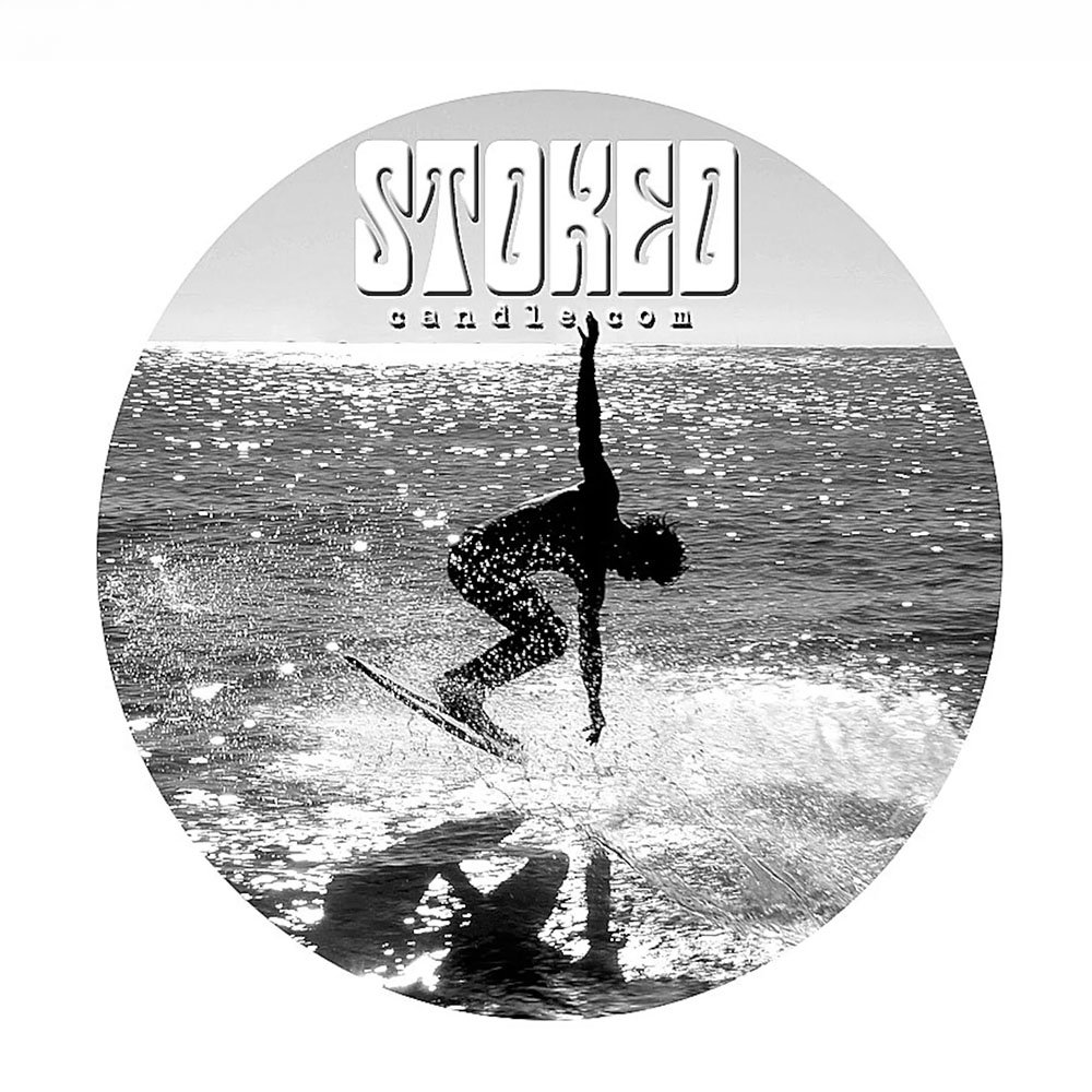 Round Stoked Candle logo sticker showing black and white vintage surfer photo with Stoked Candle text