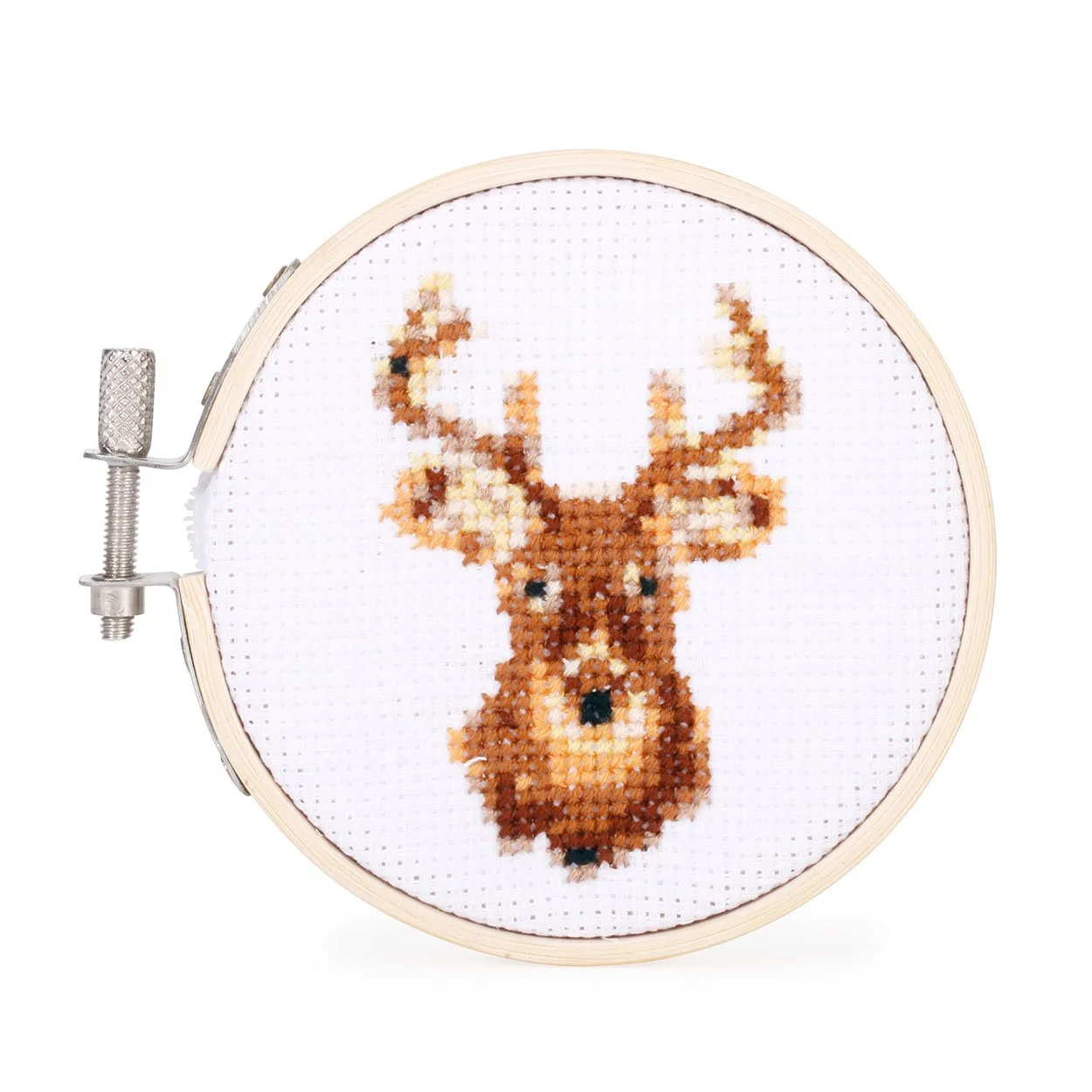 Completed mini deer head cross stitch in a bamboo hoop frame on white background