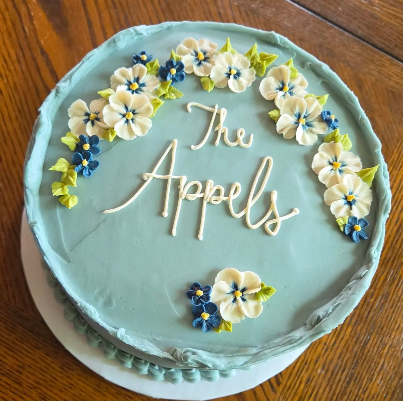 blue wedding cake with couple name