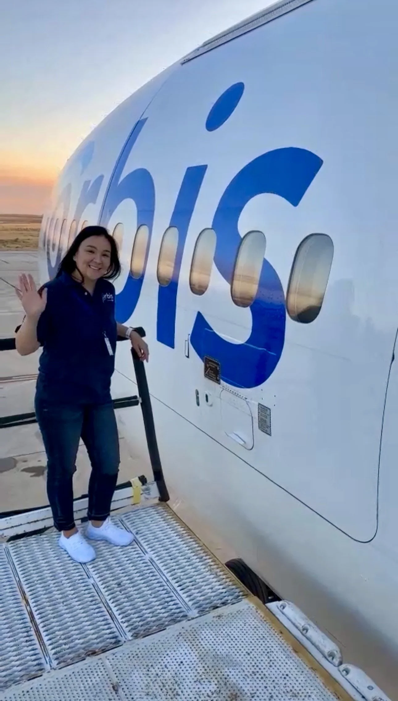 Bulgan waves, standing outside the Flying Eye Hospital