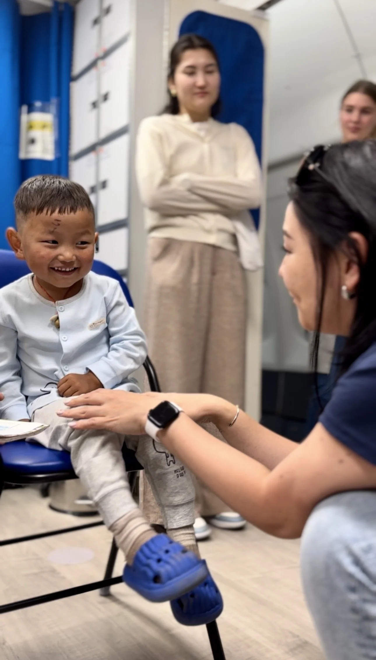 Bulgan interacts with a young boy patient