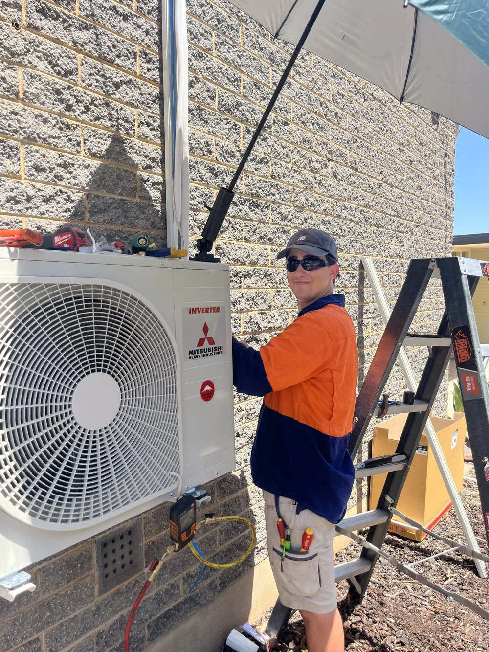 Mitsubishi Heavy Industries outdoor unit being installed
