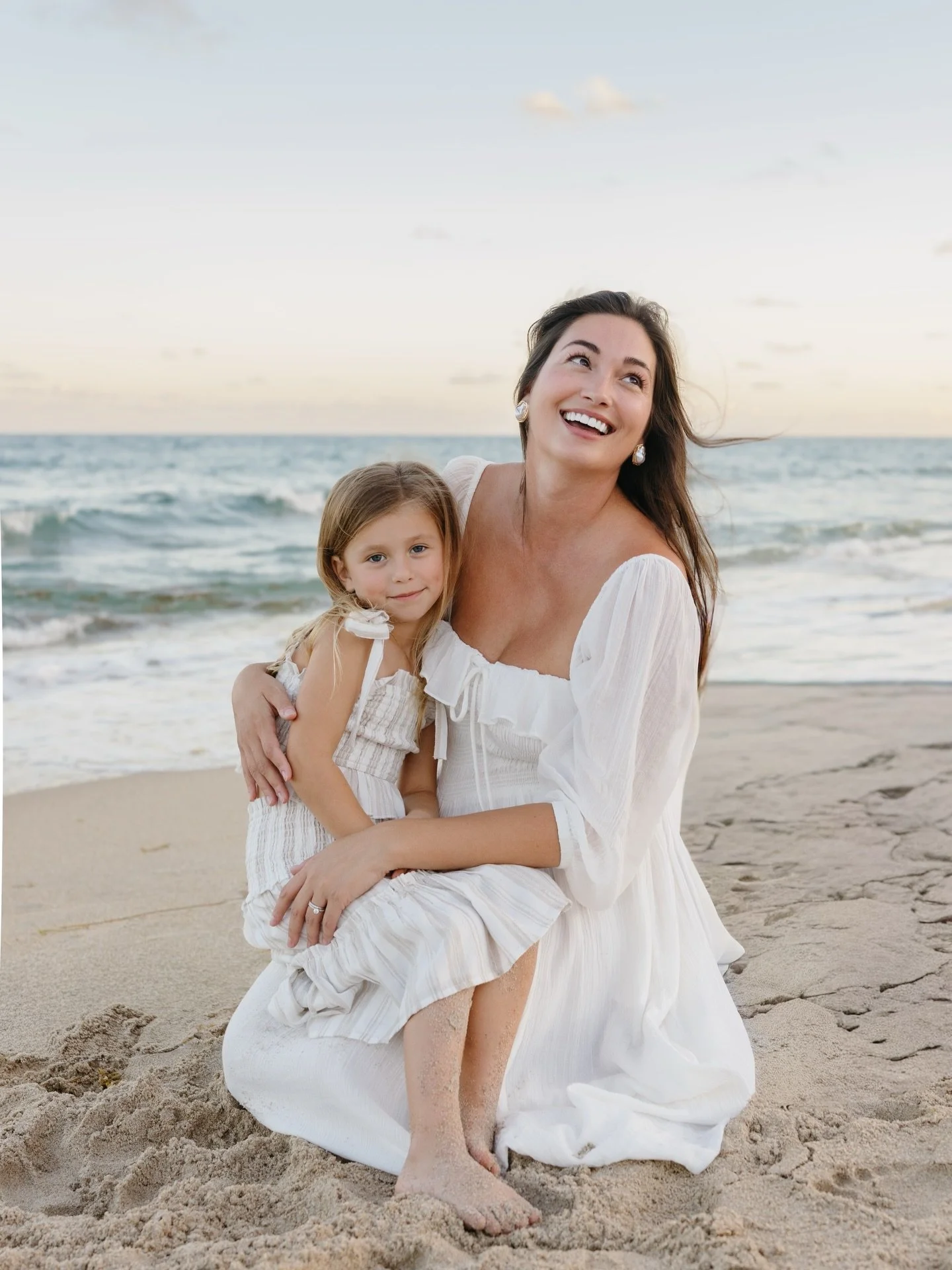 Beach family sessions are honestly one of my favorite things to photograph.
Not because of the backdrop (though, I mean&hellip;  not complaining about pink skies! 💓). But because something about being outside, barefoot in the sand, just being togeth