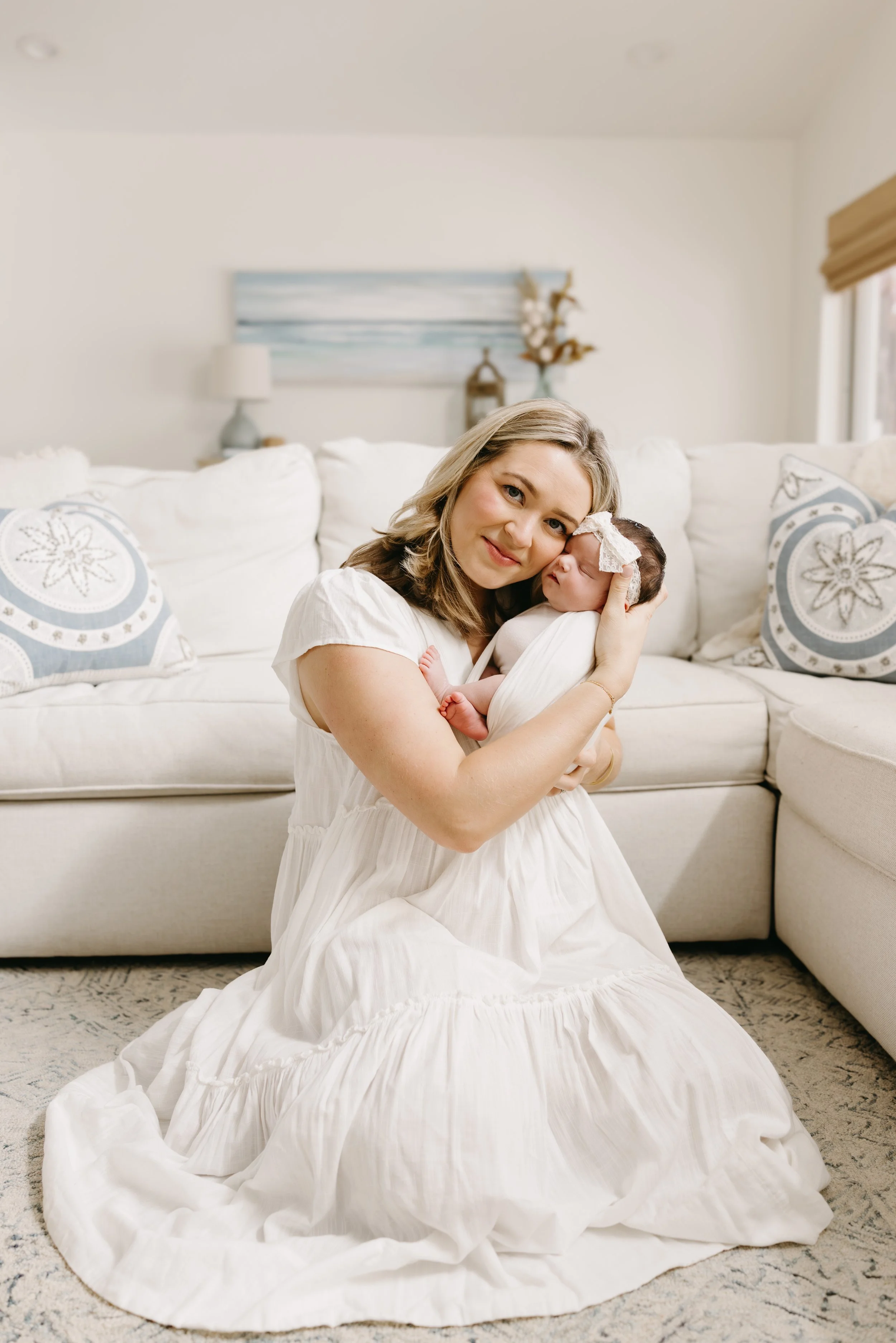 palm-beach-mom-cradling-newborn-in-home-portrait