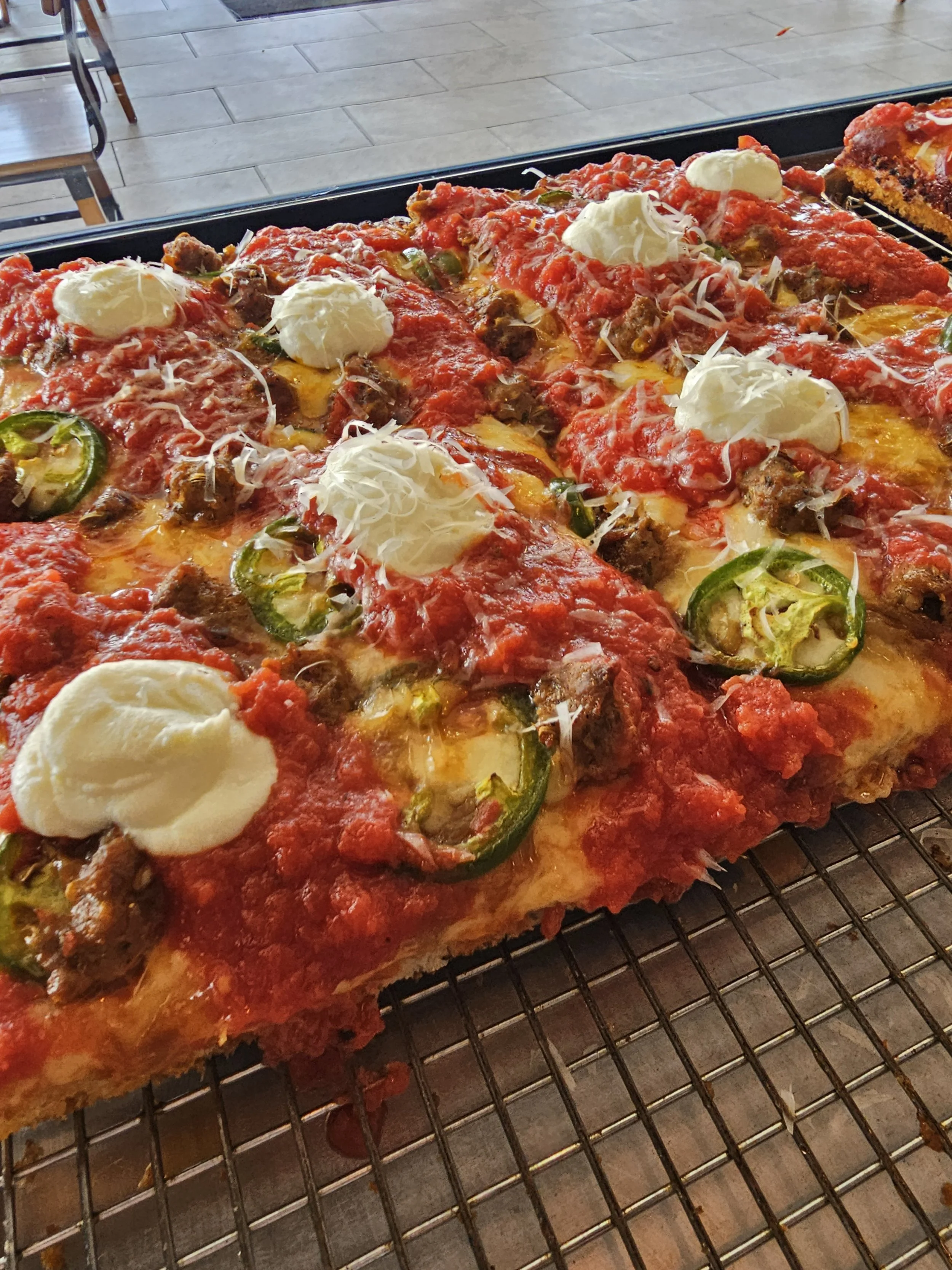 sausage & peppers detroit style pizza by the slice