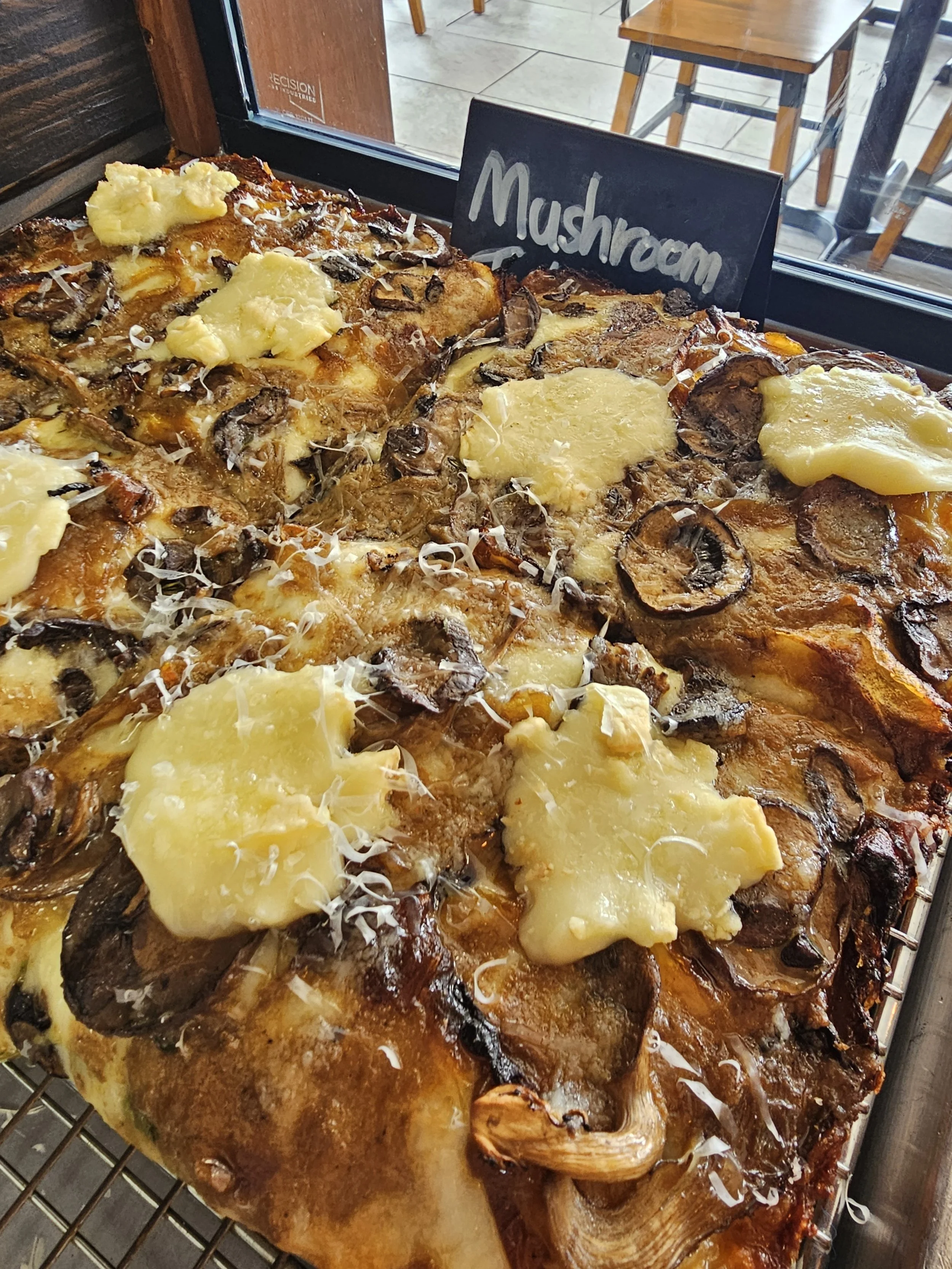 mushroom taleggio detroit style pizza by the slice