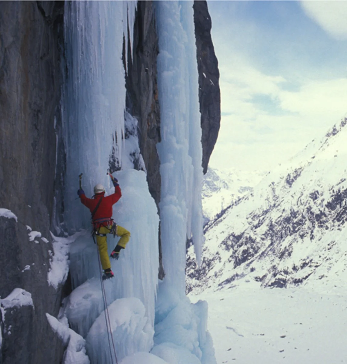 Late winter 1989 or 1990: Thierry Renault attempting a route that would eventually become "Nuits Blanches" above the Argentiere Glacier but this day it was too warm and that pillar was making noises like it wouldn't be standing for long so we bailed.