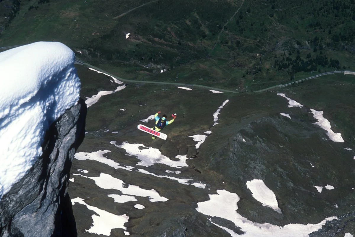 June 1990: Dominique Gleizes exiting the west face of the Eiger. It was his 50th base jump and almost his last as the snowboard flipped him upside down