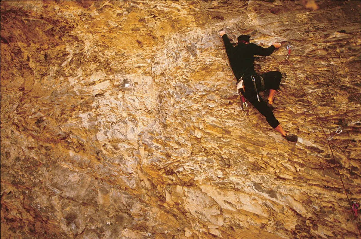 Late-90s: I was in Santaquin Canyon, Utah with Geoff Weigand and Tiffany Levine to shoot some pictures. Geoff had been working on a route he named “Drinking Gasoline” and he thought he could send it for the camera that day. He was in a period when he