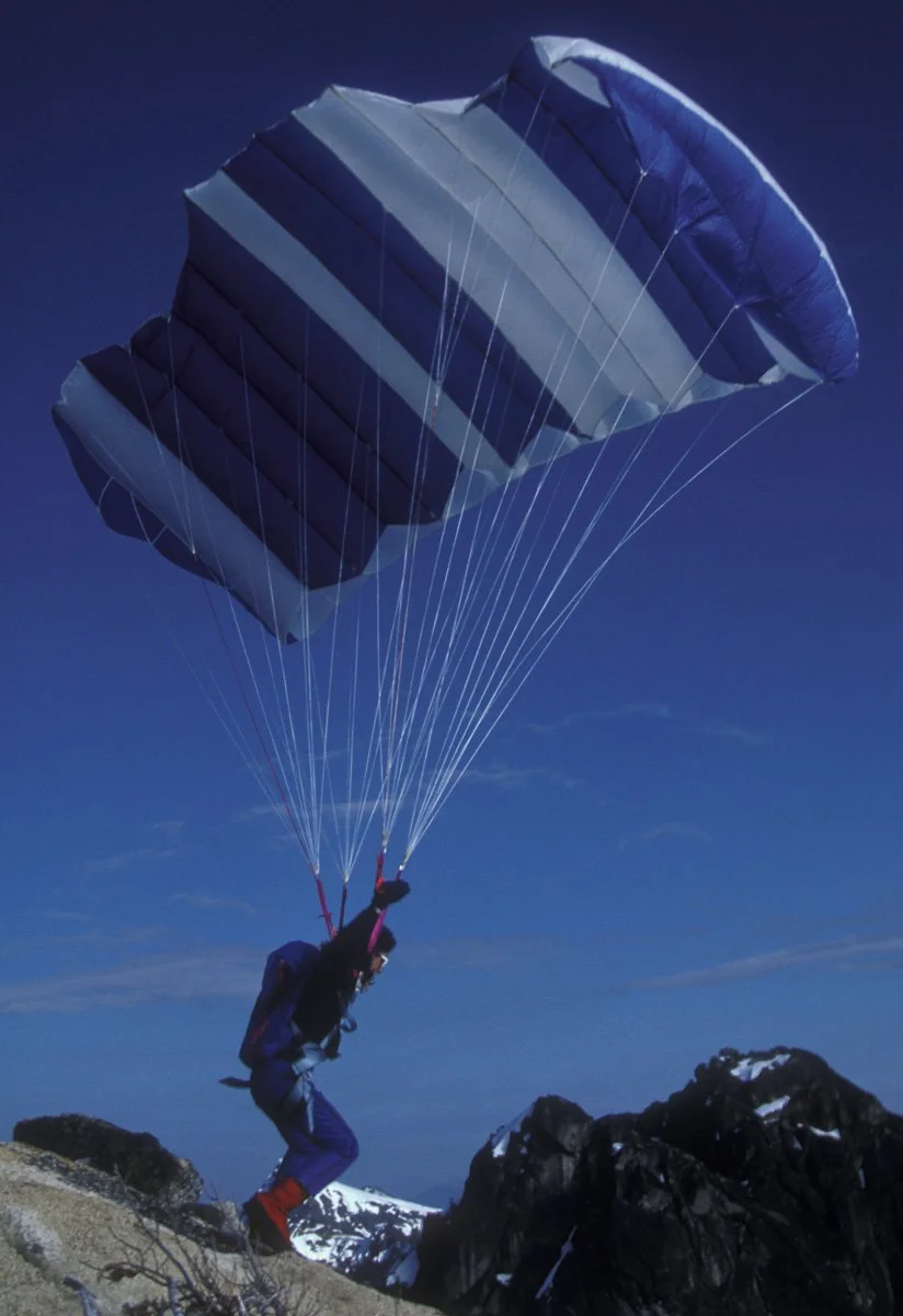 1987: Jonny Blitz filling the wing on top of Liberty Bell in the North Cascades. The take-off was dicey: fill it, run a few steps, jump to a small ledge and if it wasn’t happening abort or fall off the West Face. I recall he took 17 tries before laun