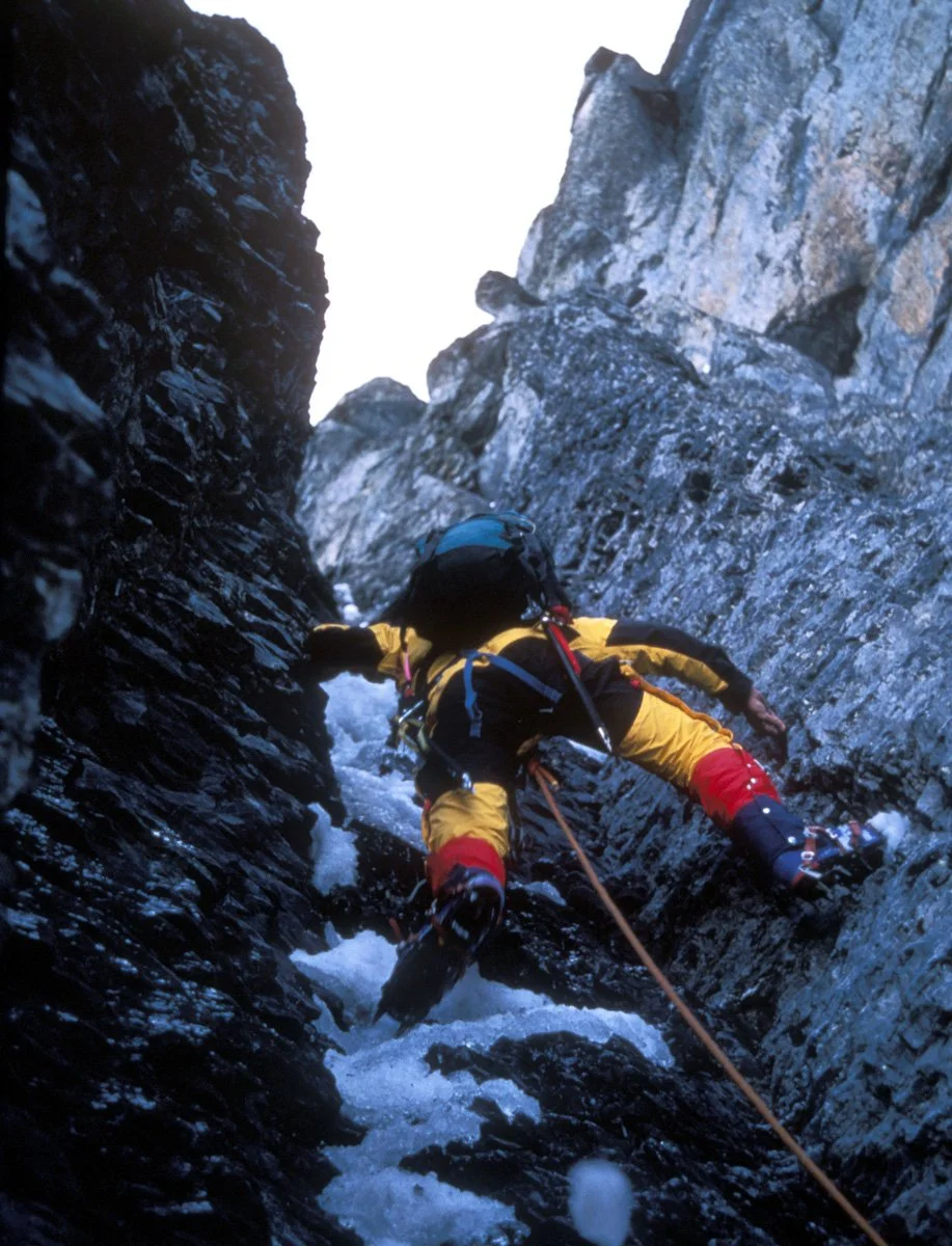 Alan Bradley in the Exit Cracks on the north face of the Eiger. The belay anchor was crap and the cracks above bottomed-out or were worn round by centuries of flowing water. A long way above us, when he was well run-out Eric and I heard him mumble, "