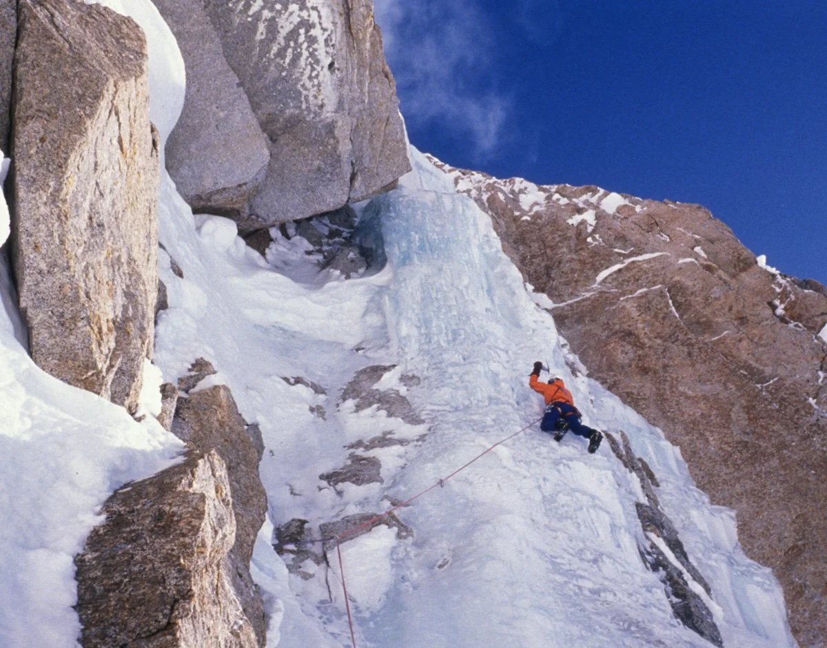 May 1994: Leading the steep ice pitch through the 4th rock band during the first ascent of “Deprivation” on Mount Hunter. It was genuinely hard. We called it grade 6. I ran out of screws. The belay anchor sucked. Hauling both packs was “fun.” We clim