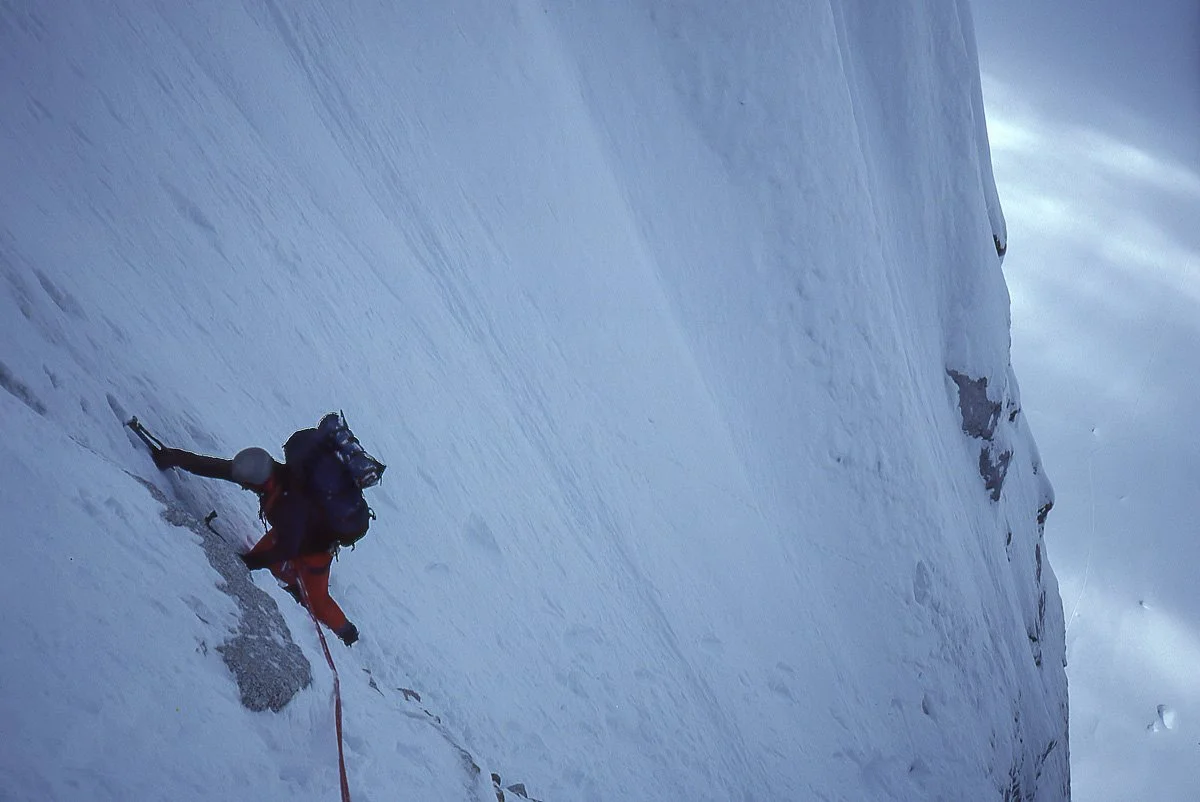 April 1985: John Stoddard high on the Colton-Leach route on the north buttress of the Rooster Comb in Alaska, gunning for a bivouac site 16 pitches up.