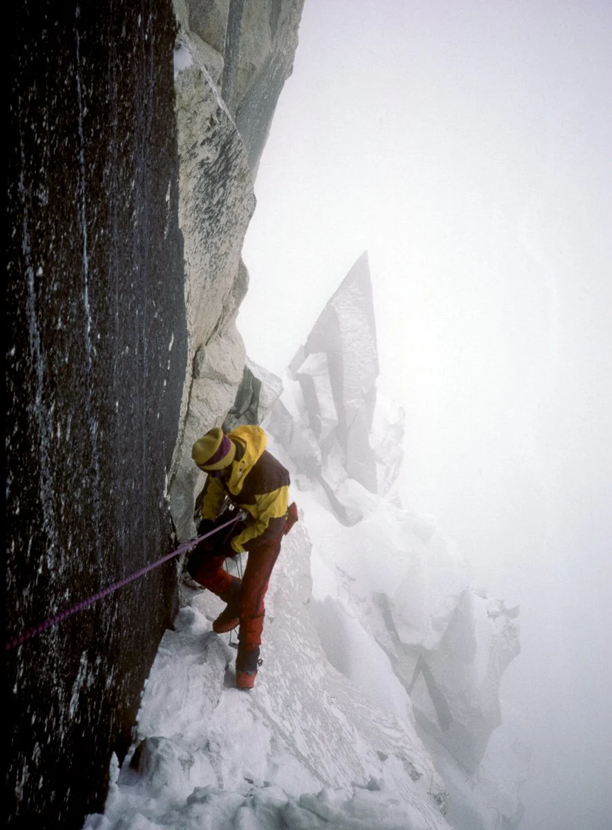 May 1986: Jeff Lowe rappelling back to retrieve the heavy packs during the sixth day of our pre-monsoon attempt on the south pillar of Nuptse. What we thought would be an inconsequential afternoon thunderstorm turned into nagging precipitation that e