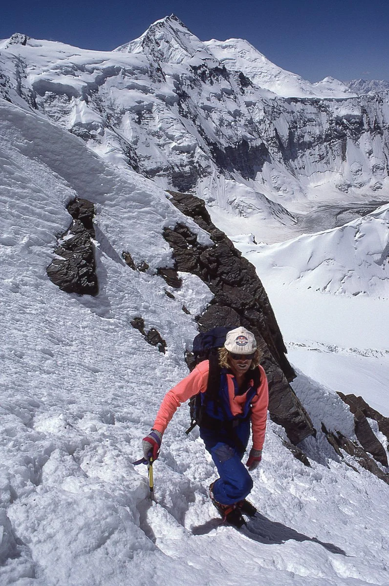 July 1990: Ace Kvale nearing the summit of “Peak of the Fourth”, aka Peak Chetireh, (6230m) in the Pamirs near Peak Communism, which has since been renamed Ismoil Somoni Peak. On our second trip to the summit we descended on telemark skis – it took a